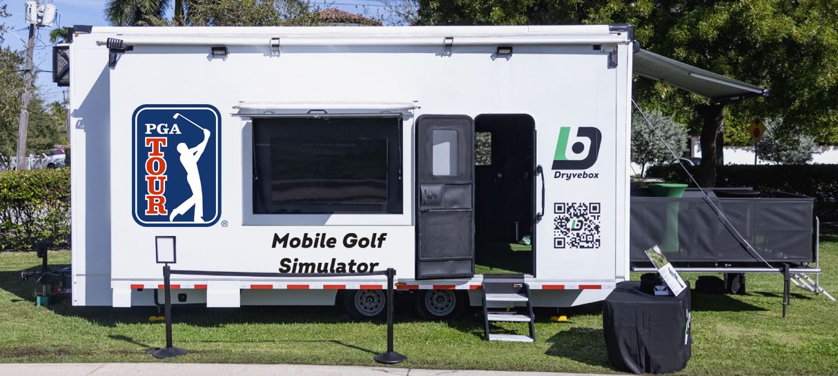 PGA Tour-branded Dryvebox trailer on the lawn at a tour event