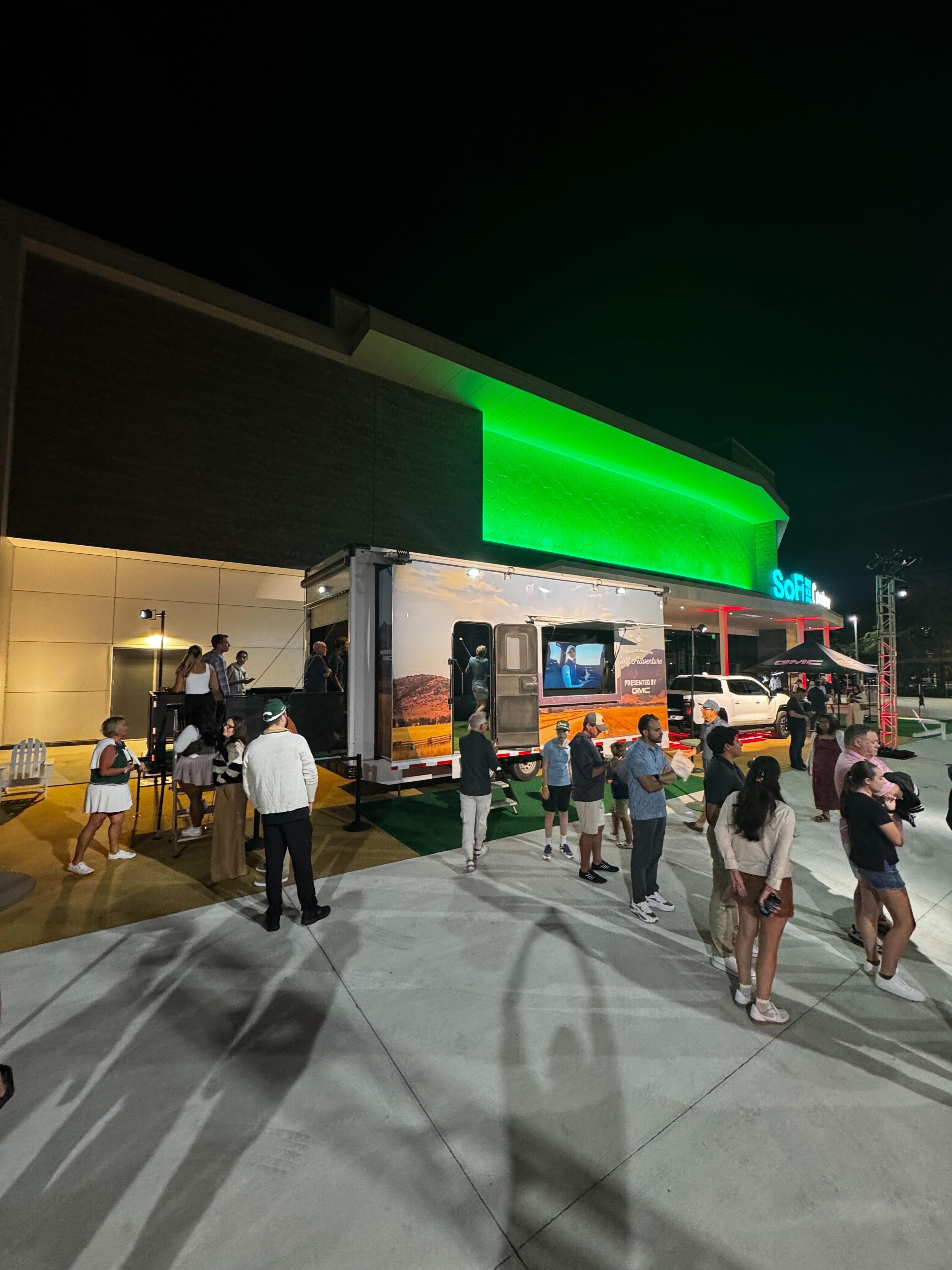 Good Good × GMC Dryvebox trailer activation at night outside SoFi Center with crowd lined up