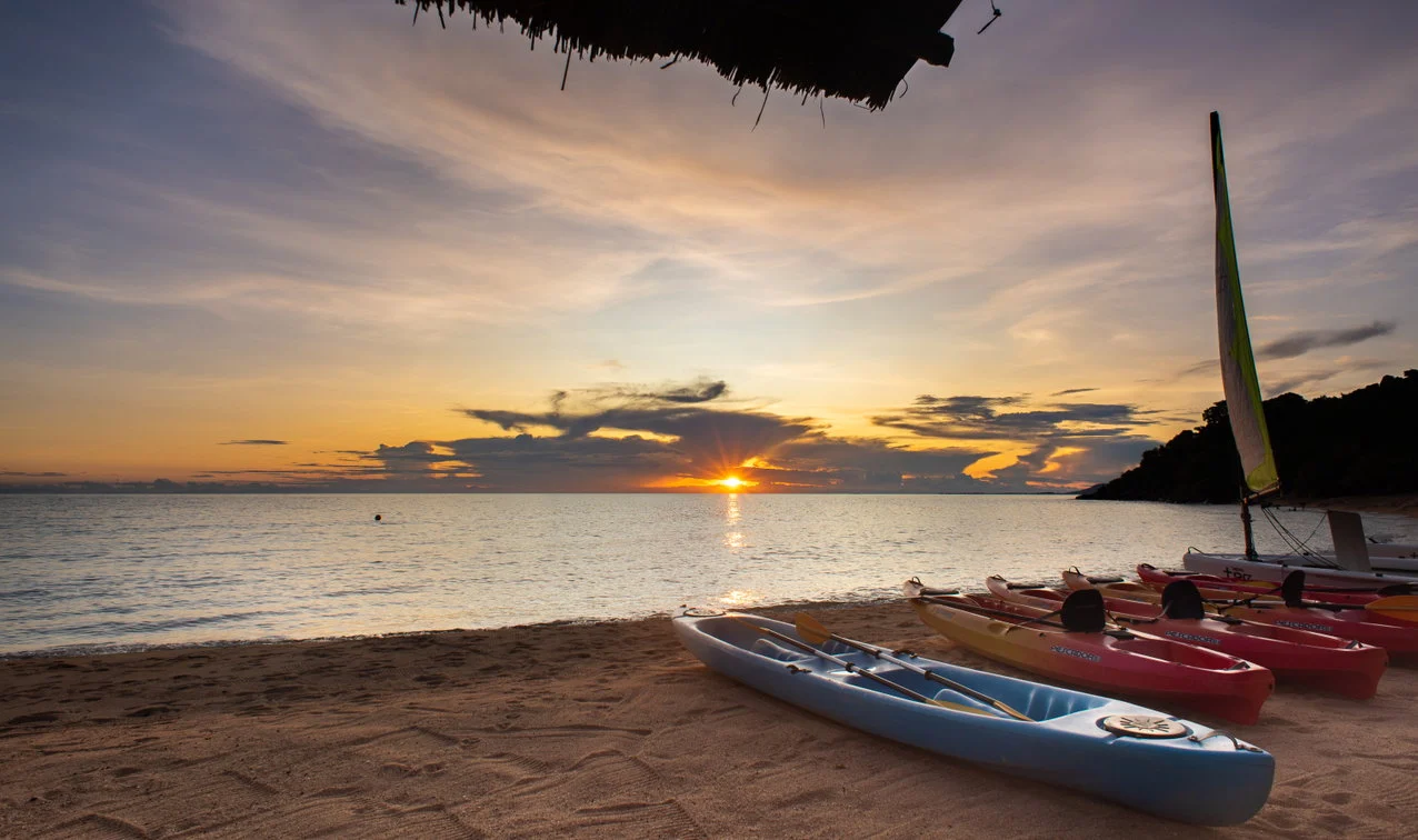 Kayaks and a beach sunset at Kaya Mawa on Likoma Island