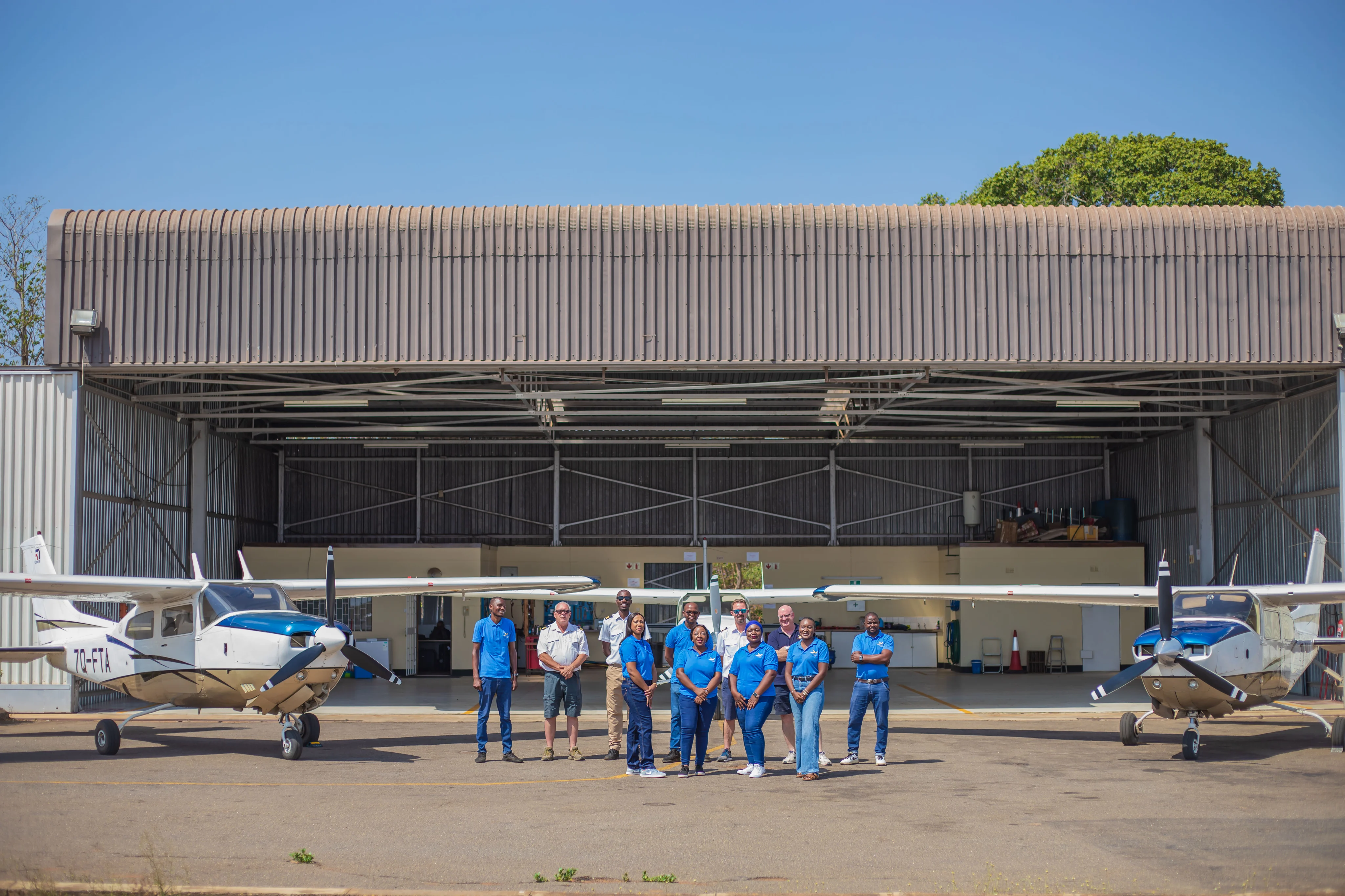 Fly Nyasa team and aircraft, illustrating the departure from Likoma