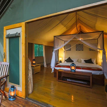 A guest tent bedroom at Ruzizi Tented Lodge