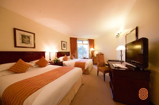 A twin guest room at Lake Kivu Serena Hotel