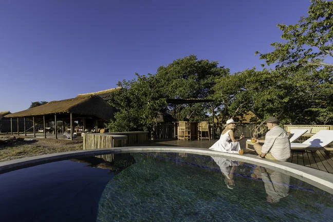 Swimming pool and deck at Camp Hwange