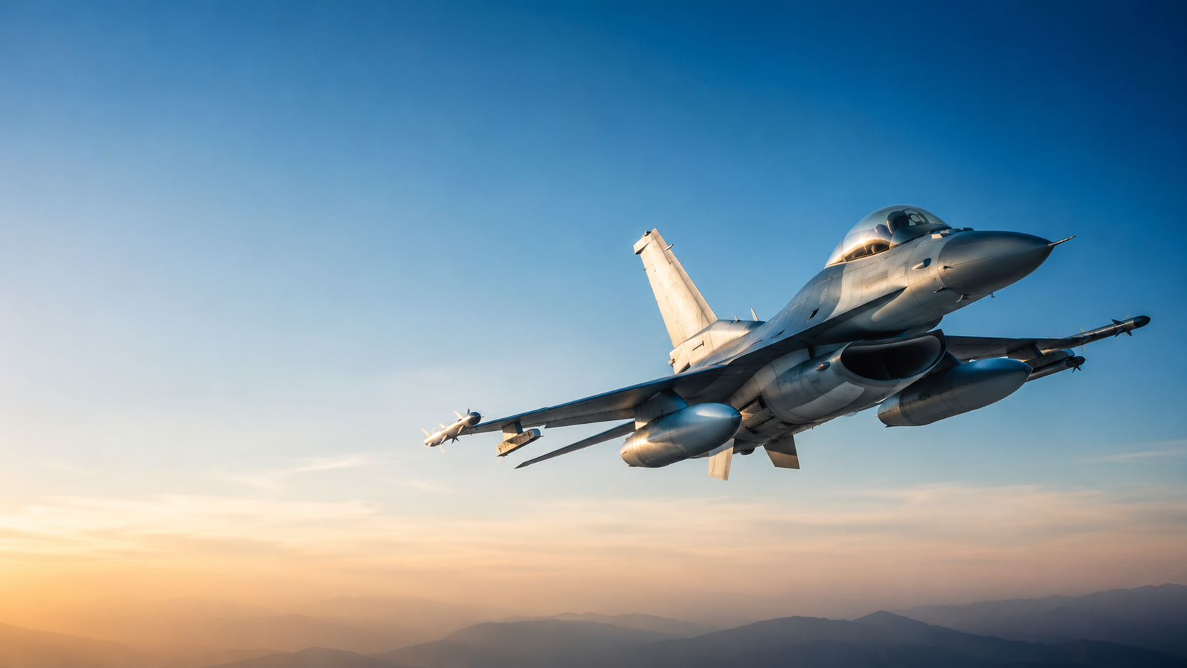 U.S. Air Force fighter jet in flight at golden hour