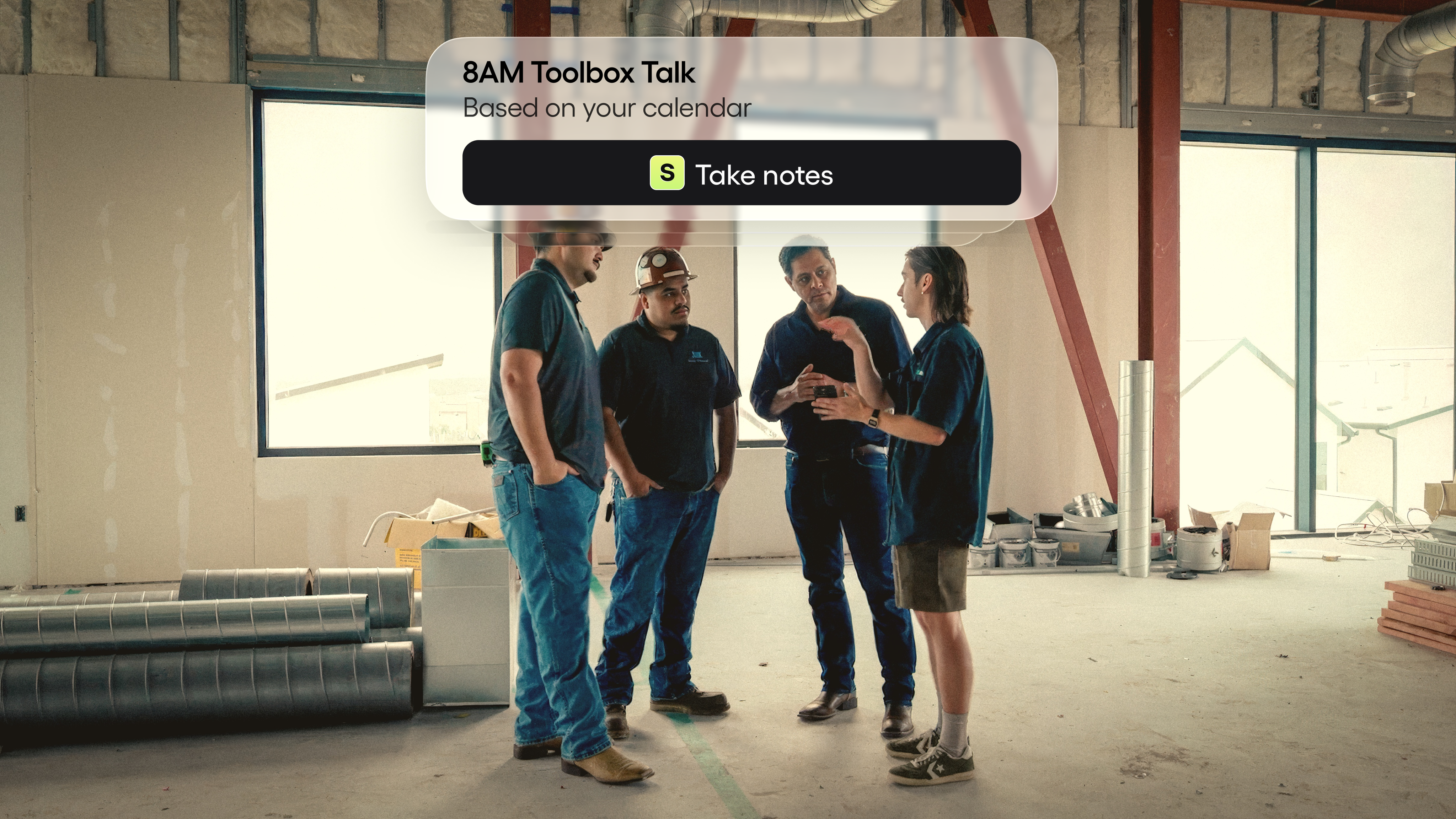 Toolbox-talk huddle of construction workers on site
