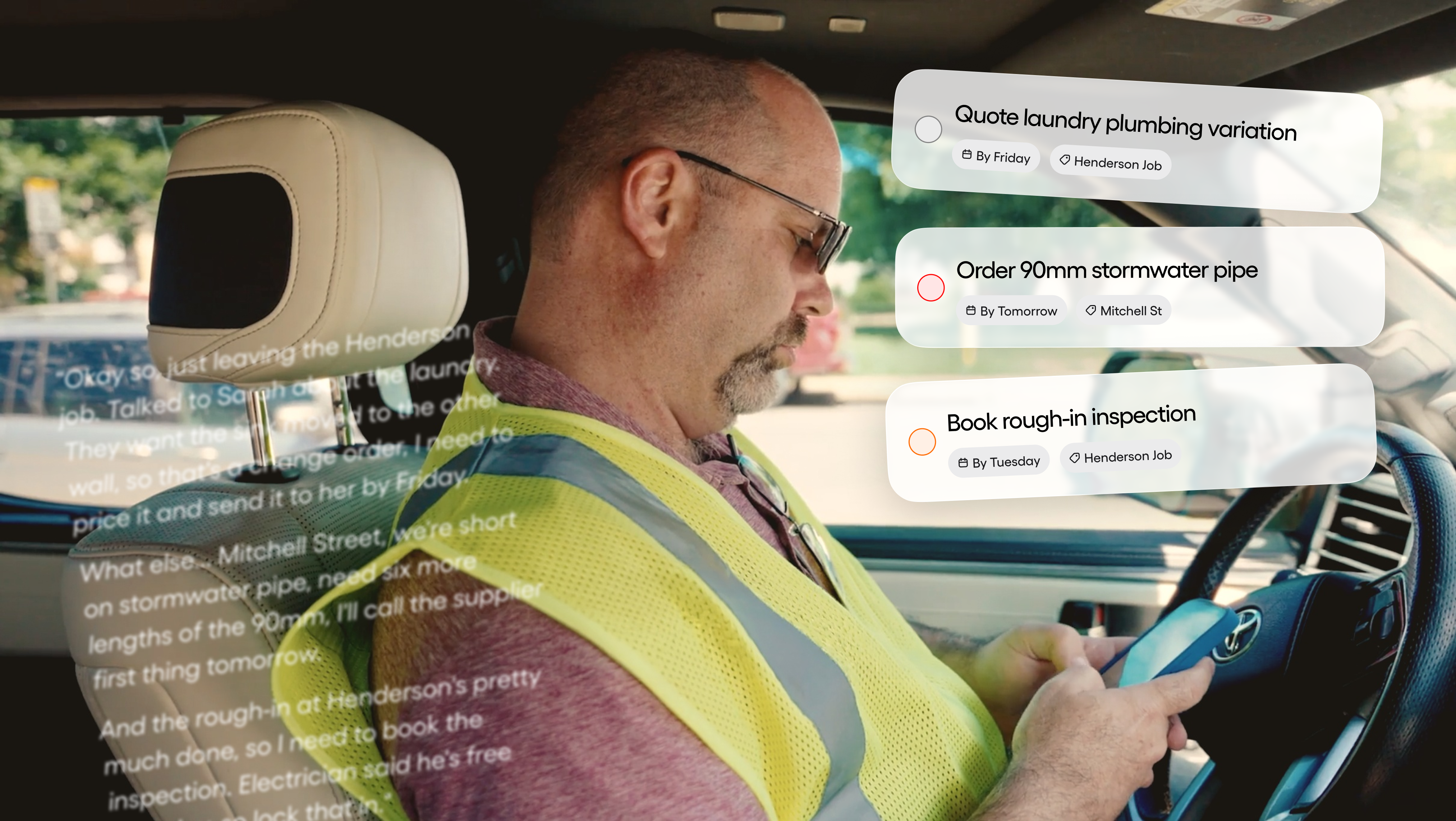 Site manager recording a voice note in the truck