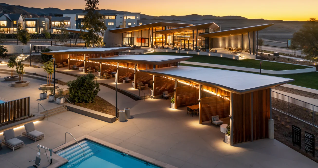 Valencia Confluence amenity center and pool lit at dusk