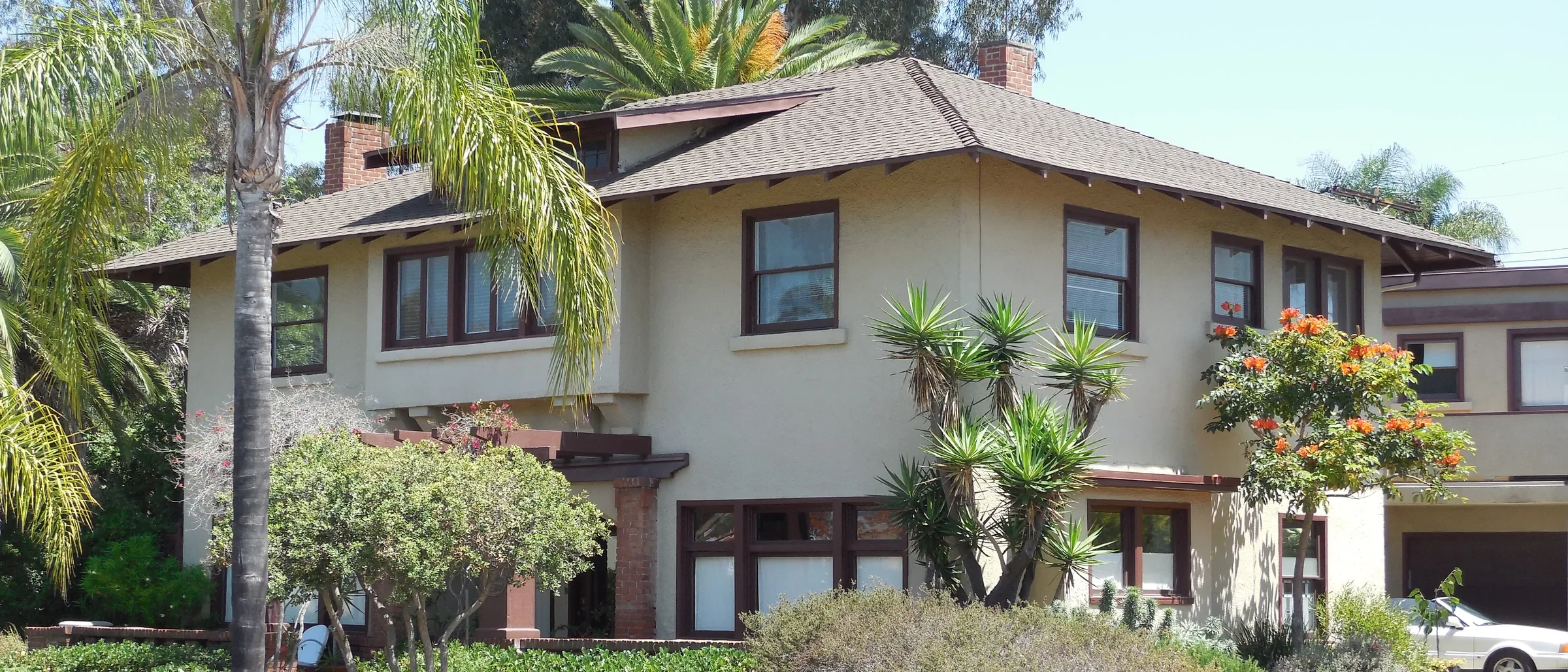 The 1912 Wegeforth-Wucher house on Laurel Street in San Diego, with palms and a drought-tolerant front garden