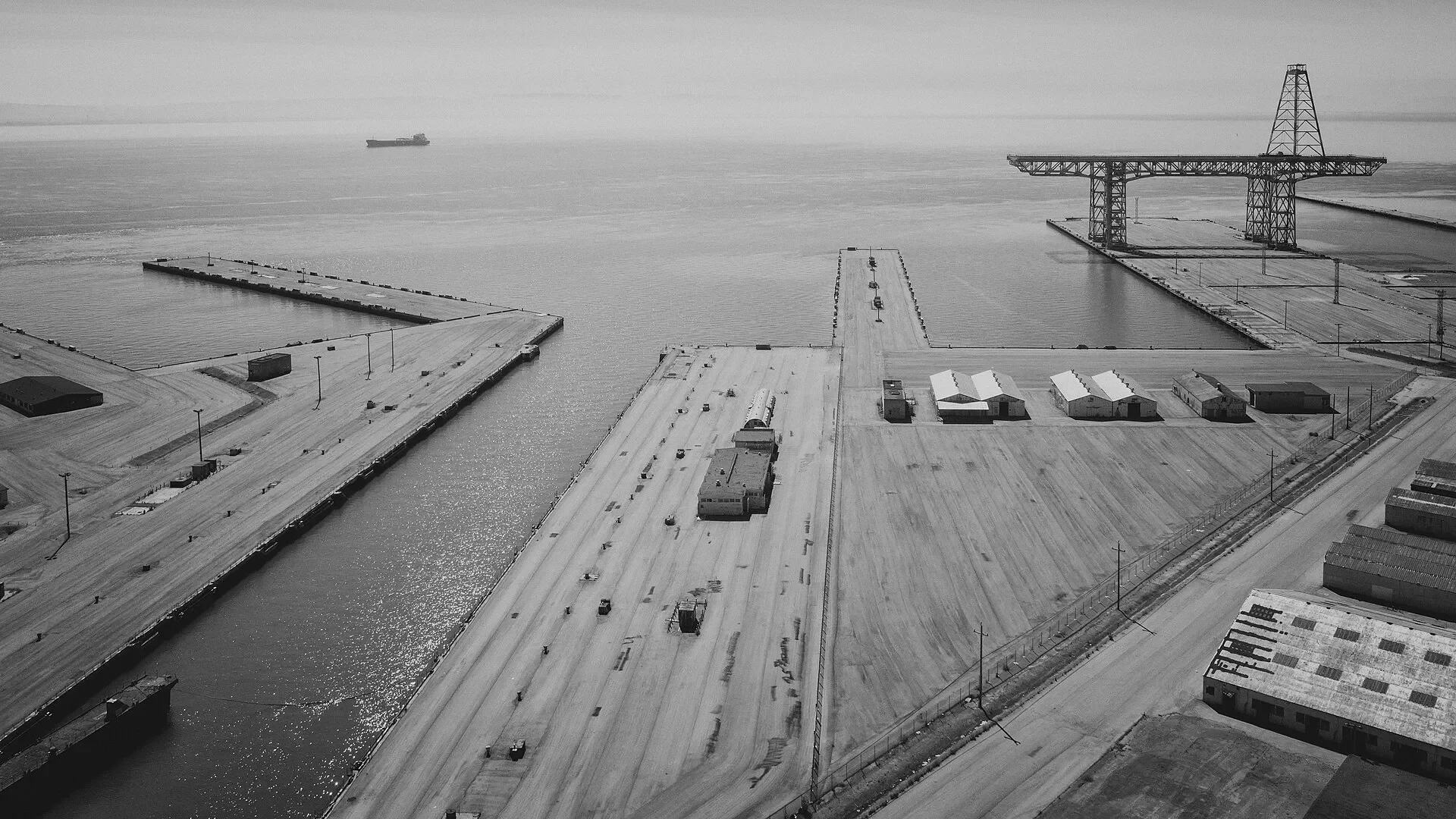 Black and white aerial view of the piers at Hunters Point Shipyard in San Francisco, California