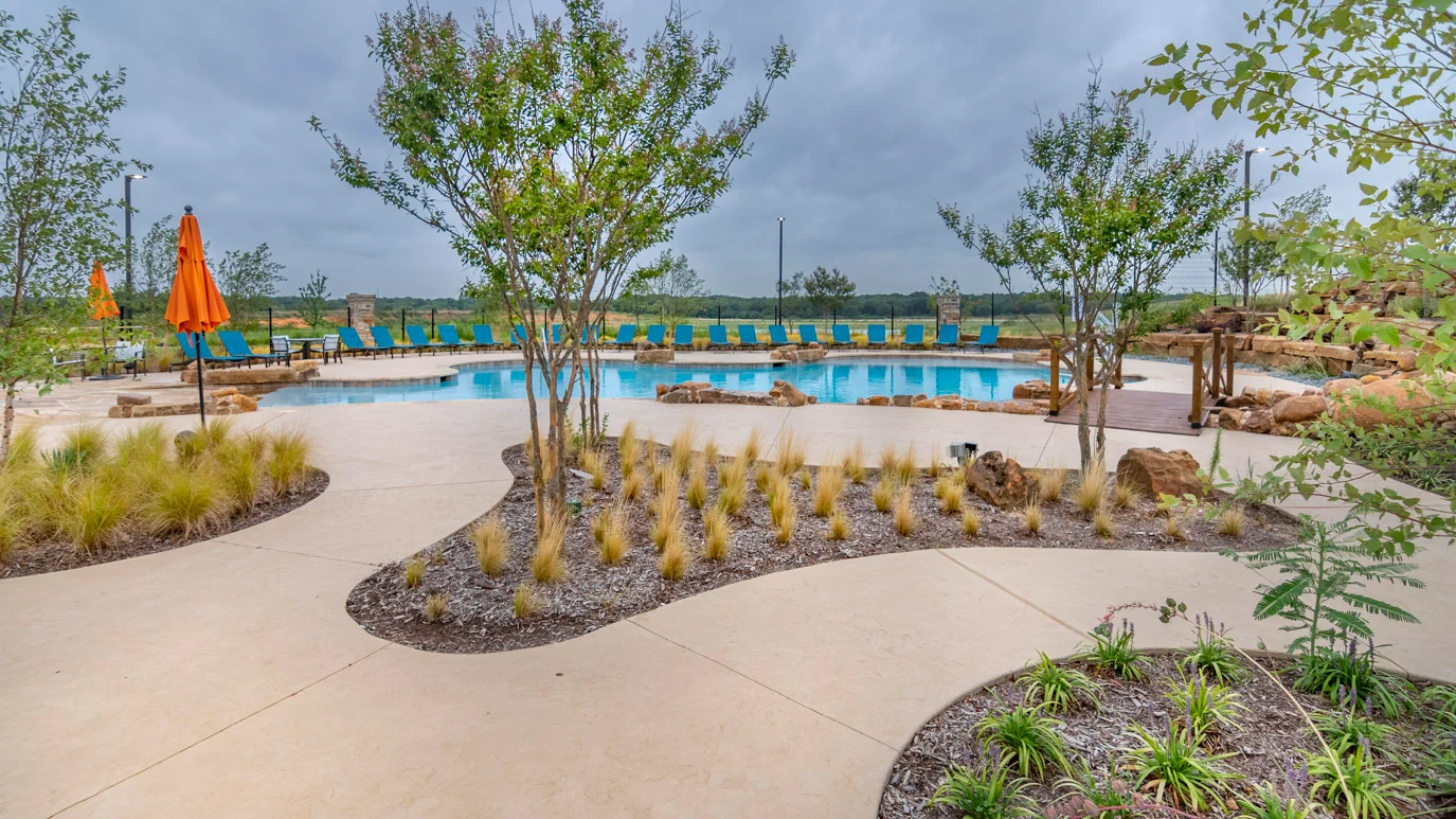 Resort-style pool and landscaped deck at Silverado in Aubrey, Texas