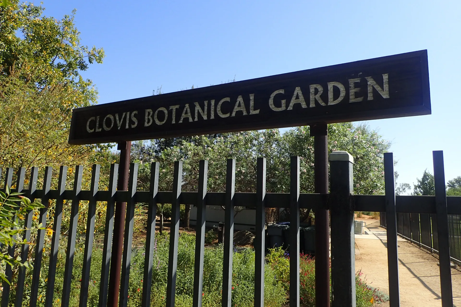 Entrance sign and fence at the Clovis Botanical Garden in Clovis, California