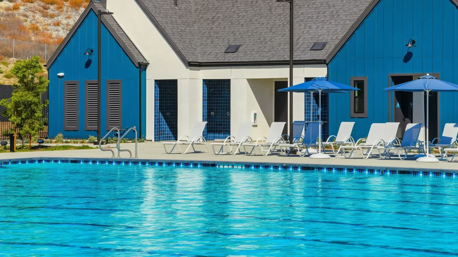 Pool and blue cabana building at Lido Swim and Social in Cota Vera, Chula Vista