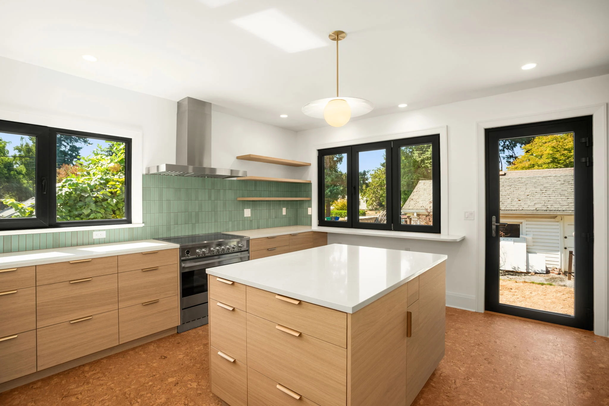 Woodstock Kitchen & Addition, a bright kitchen remodel with a wood island in Southeast Portland