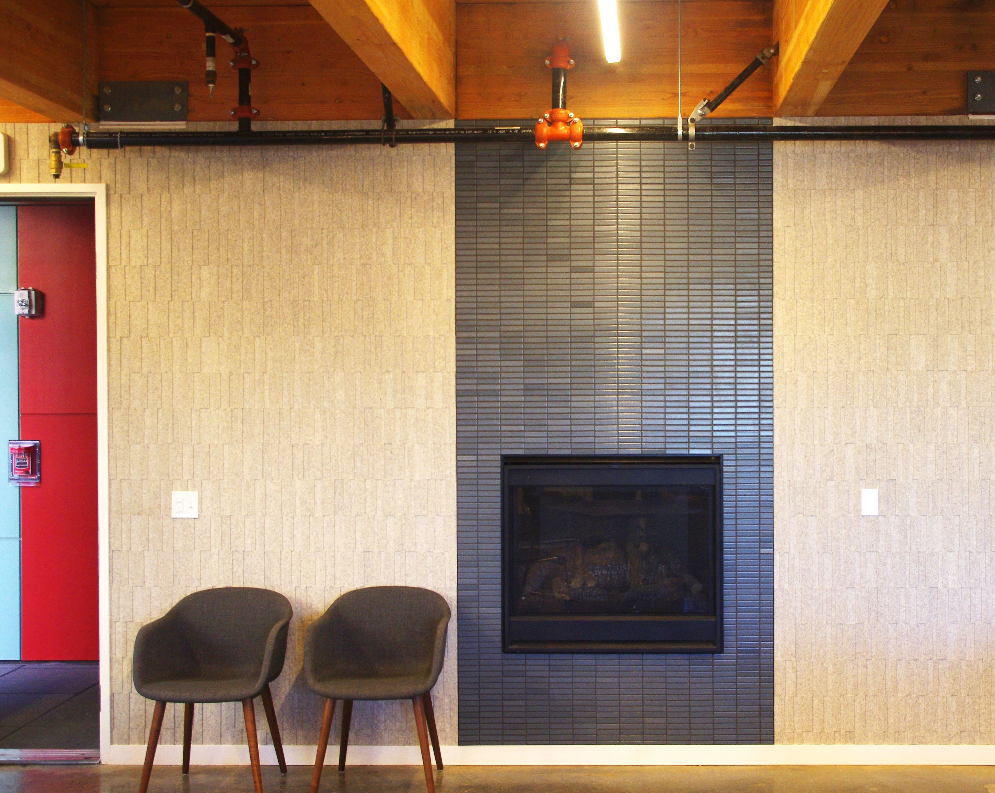PDX Commons common room with a tile fireplace, a cohousing community in Southeast Portland