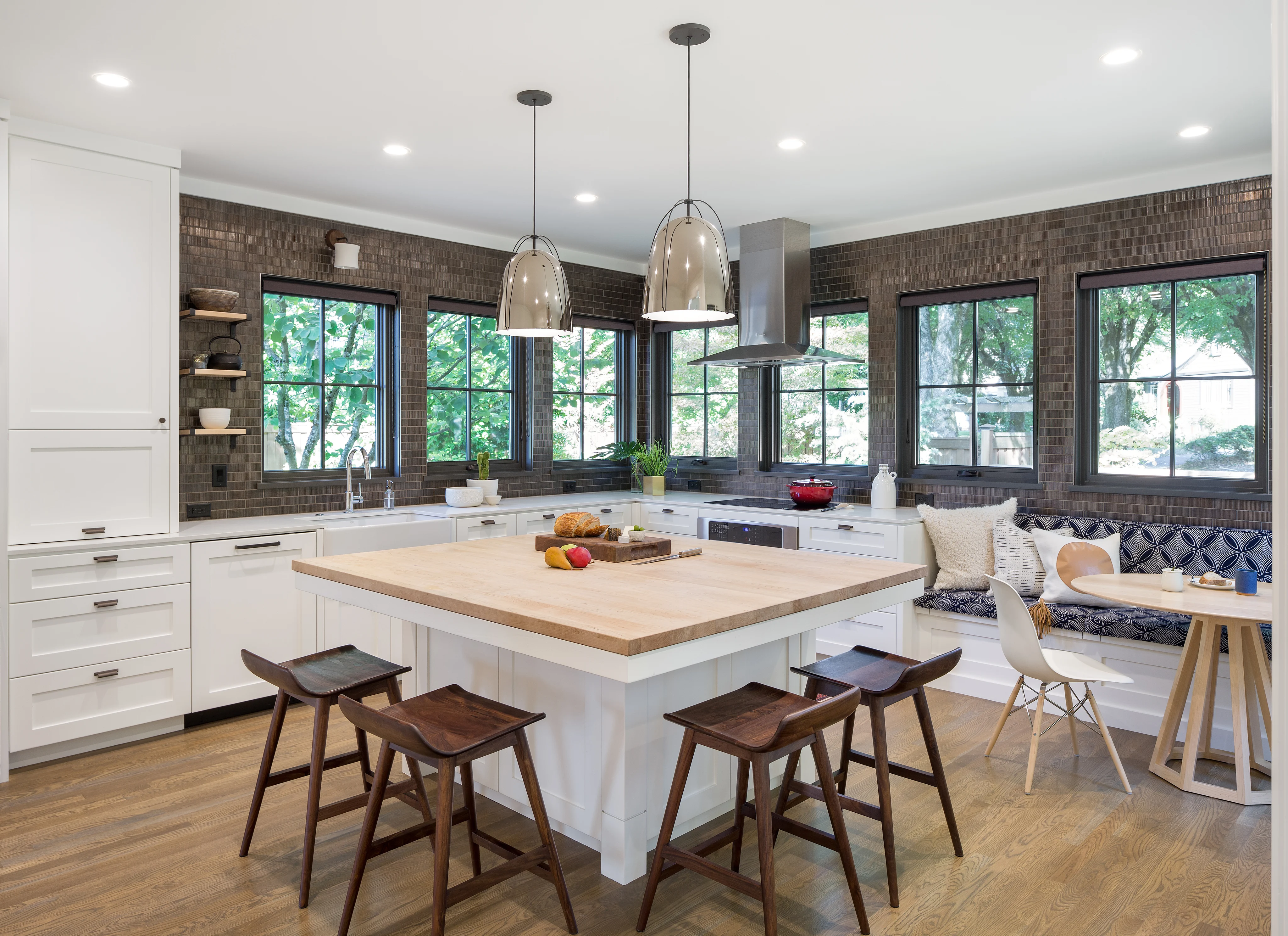 Light-filled high-performance kitchen with a wood-topped island