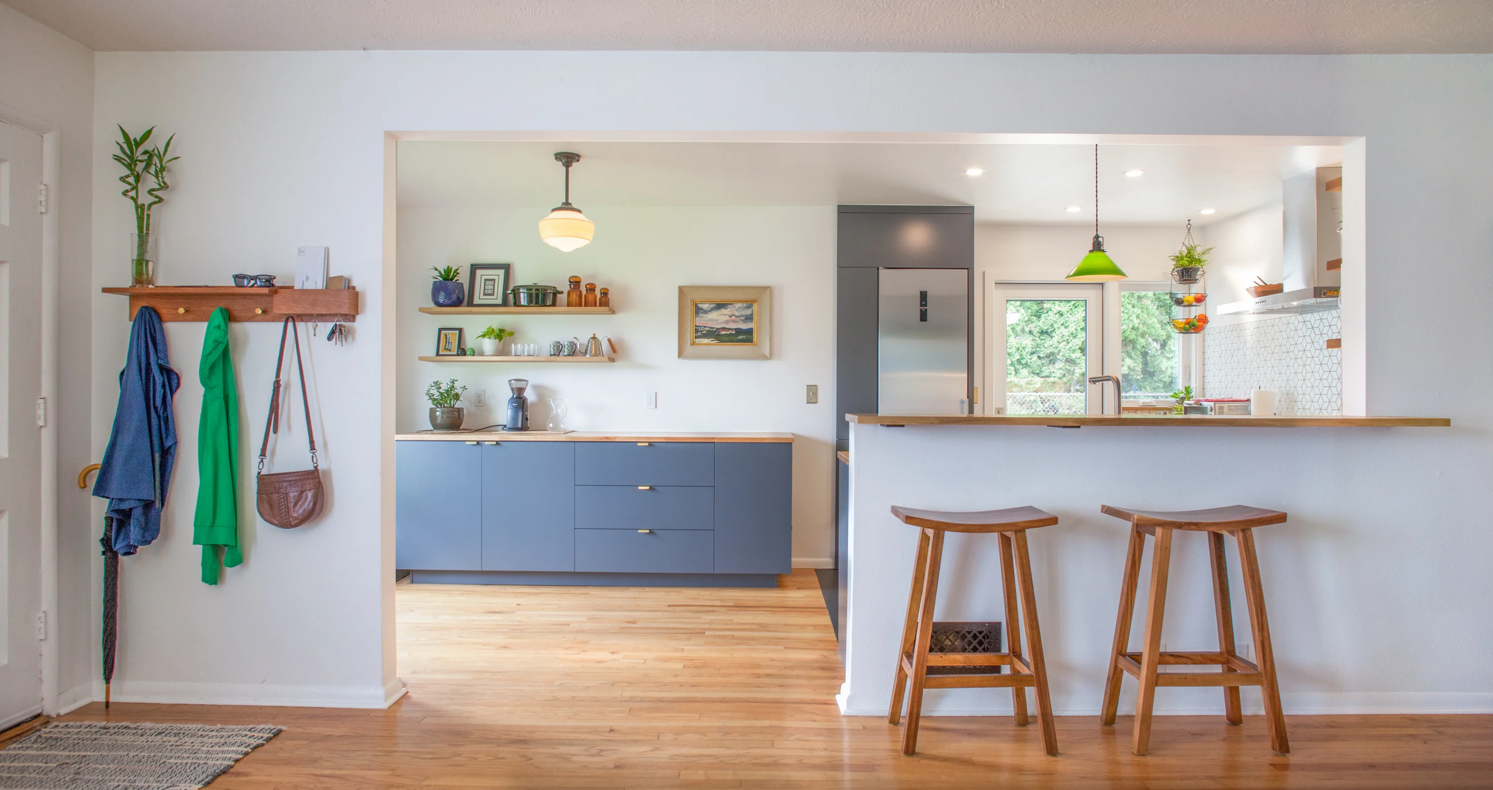 Kitchen with blue cabinets and a wood breakfast counter