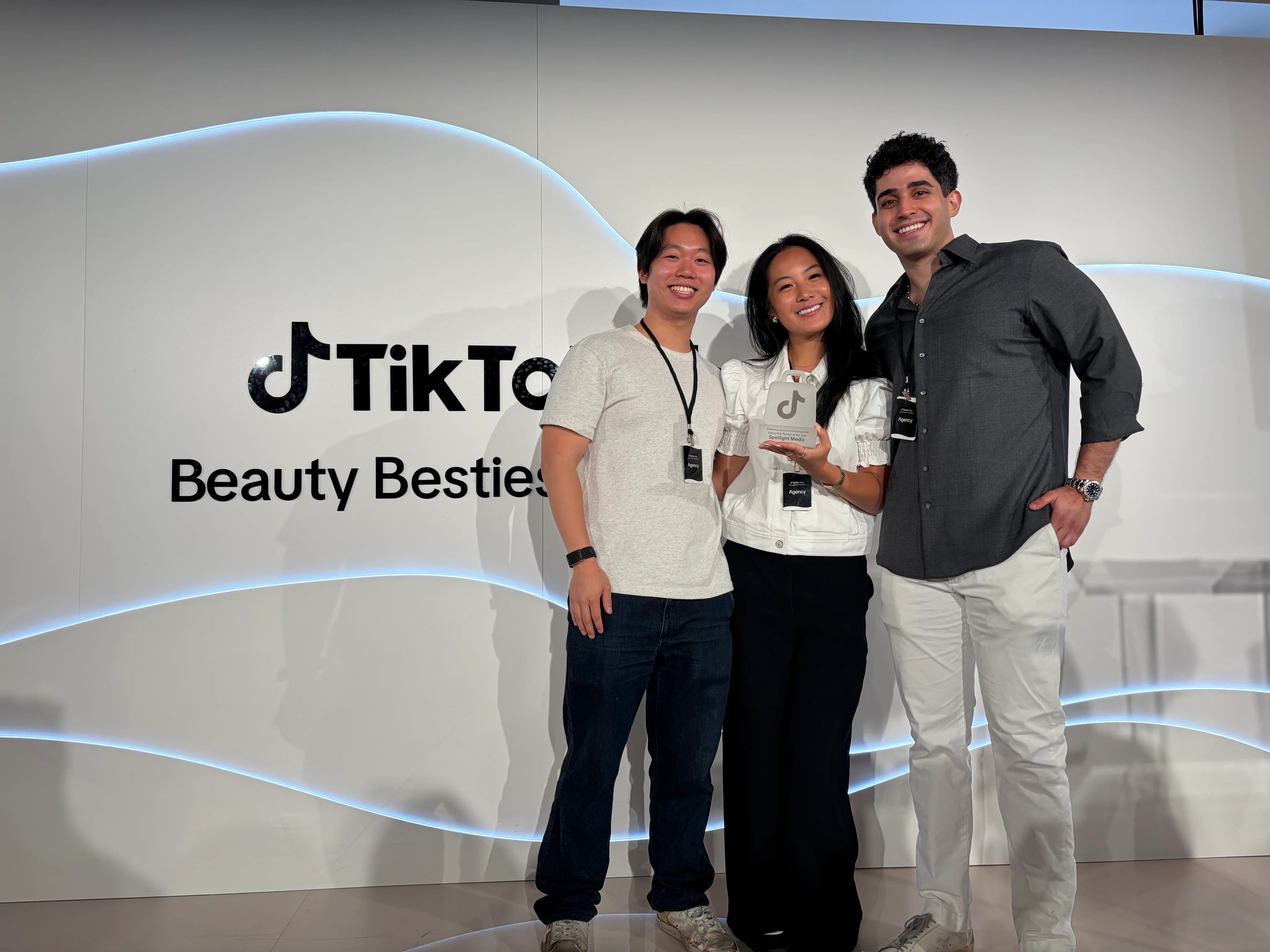 The Spotlight Media team holding the TikTok Shop Rising Star Partner award at TikTok's Beauty Besties event
