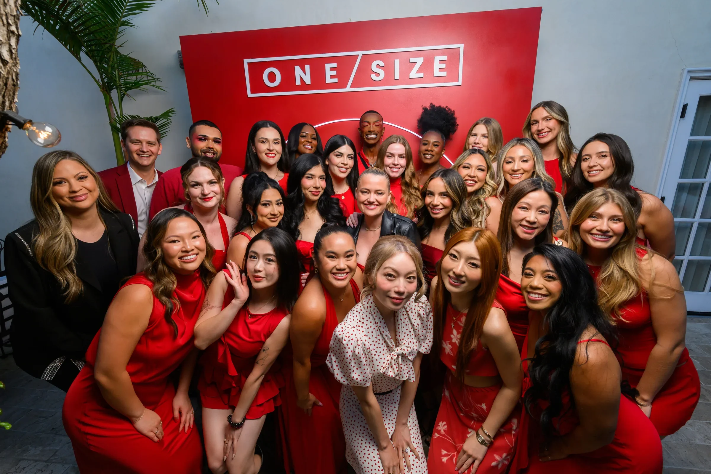 Creators dressed in red at a ONE/SIZE creator event