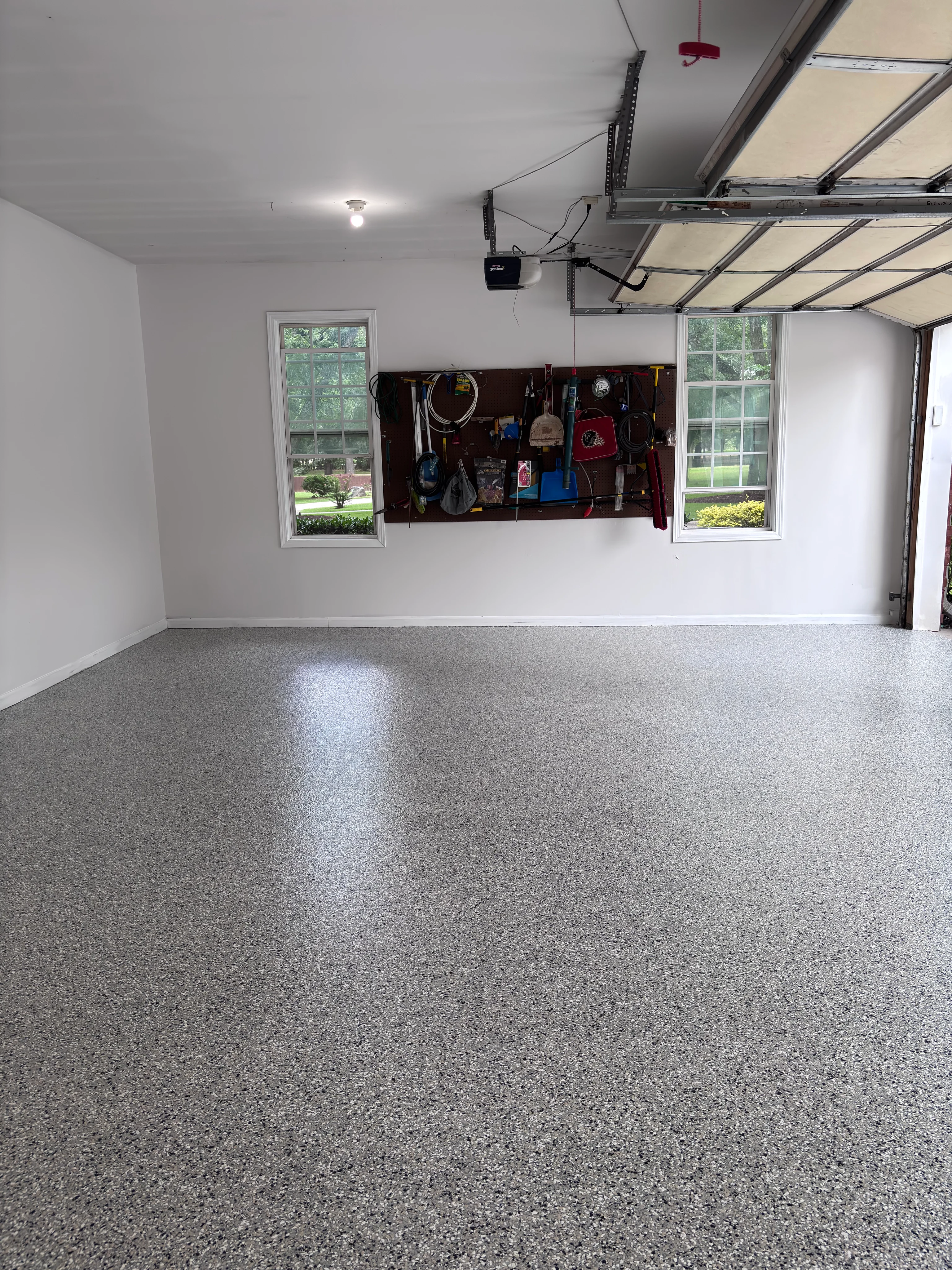 Concrete Masters v2 Gray speckled floor coating in a residential garage
