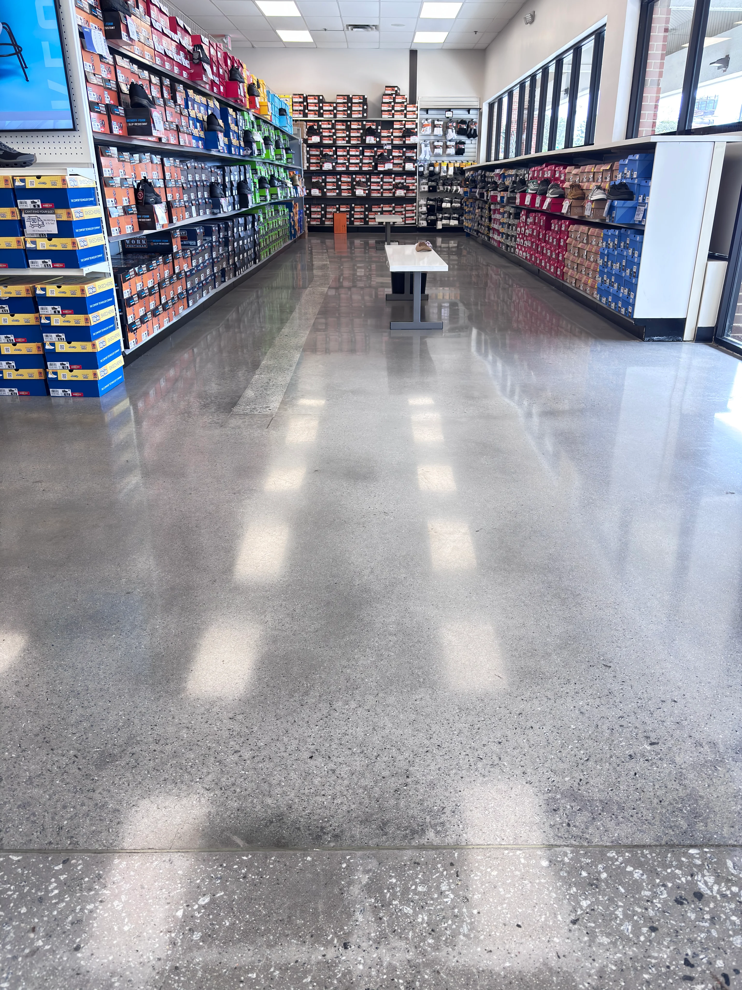 Concrete Masters v2 Polished concrete floor inside a retail shoe store