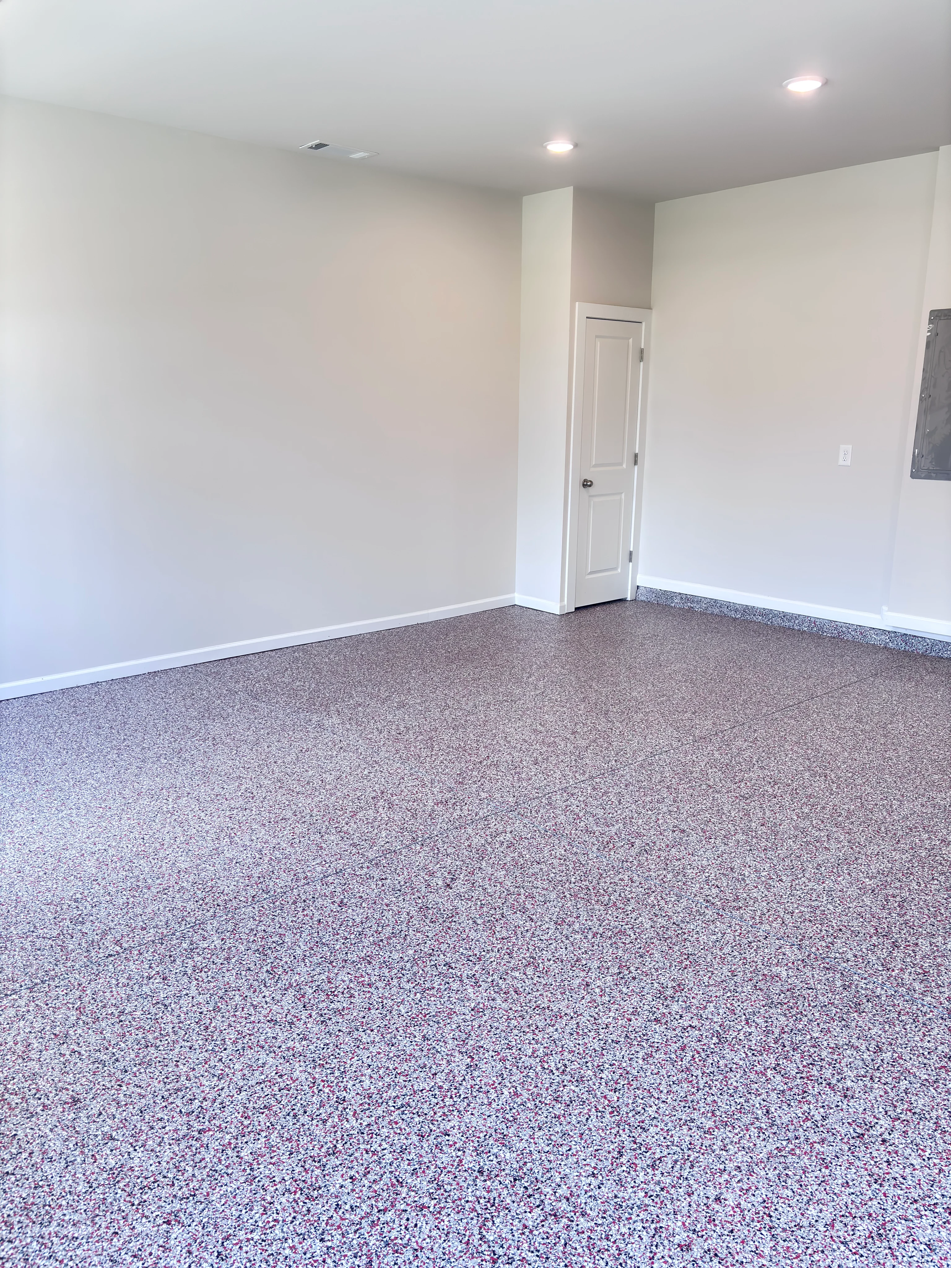 Speckled epoxy floor in an empty garage