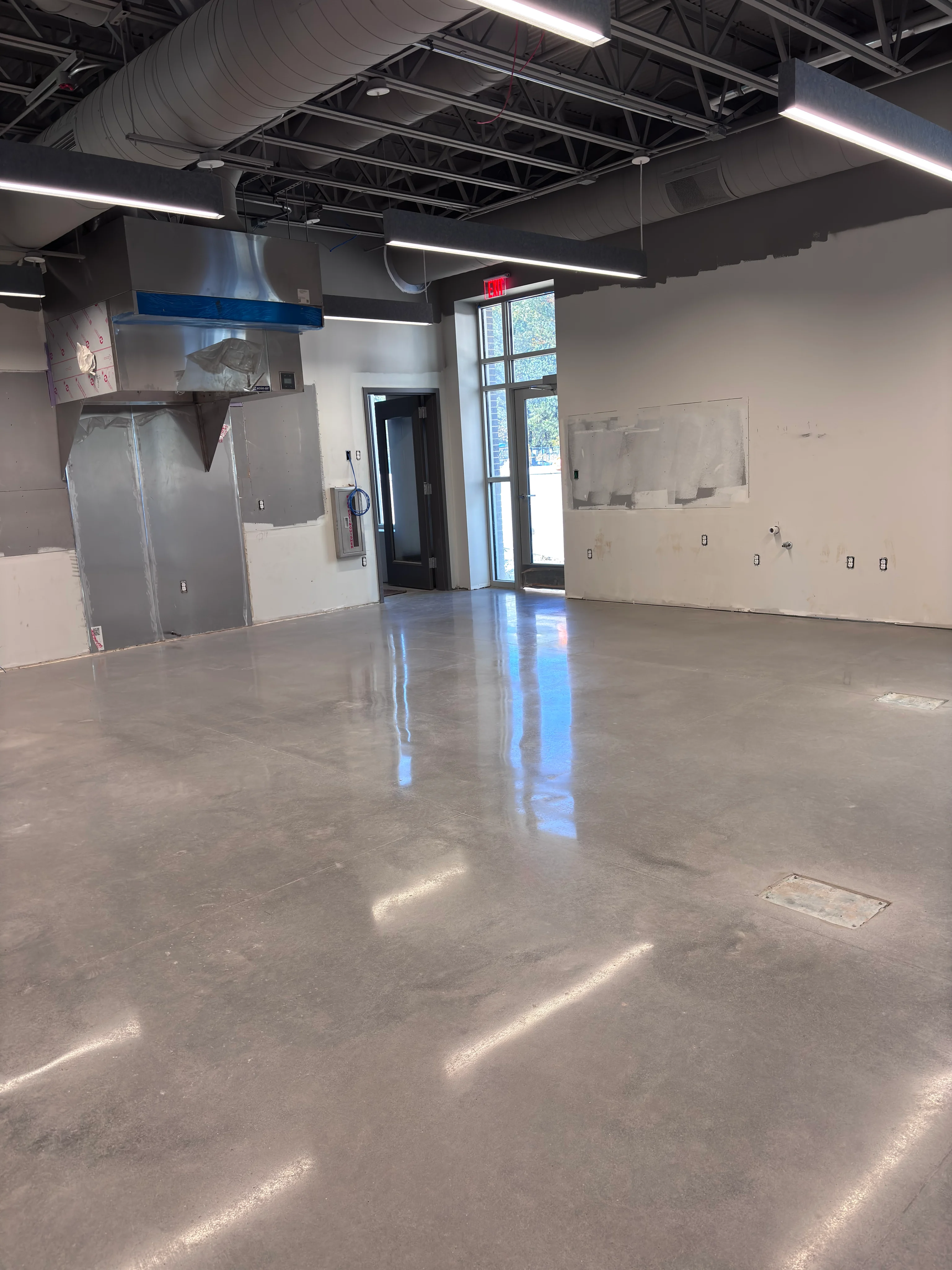 Polished concrete floor in a commercial kitchen space