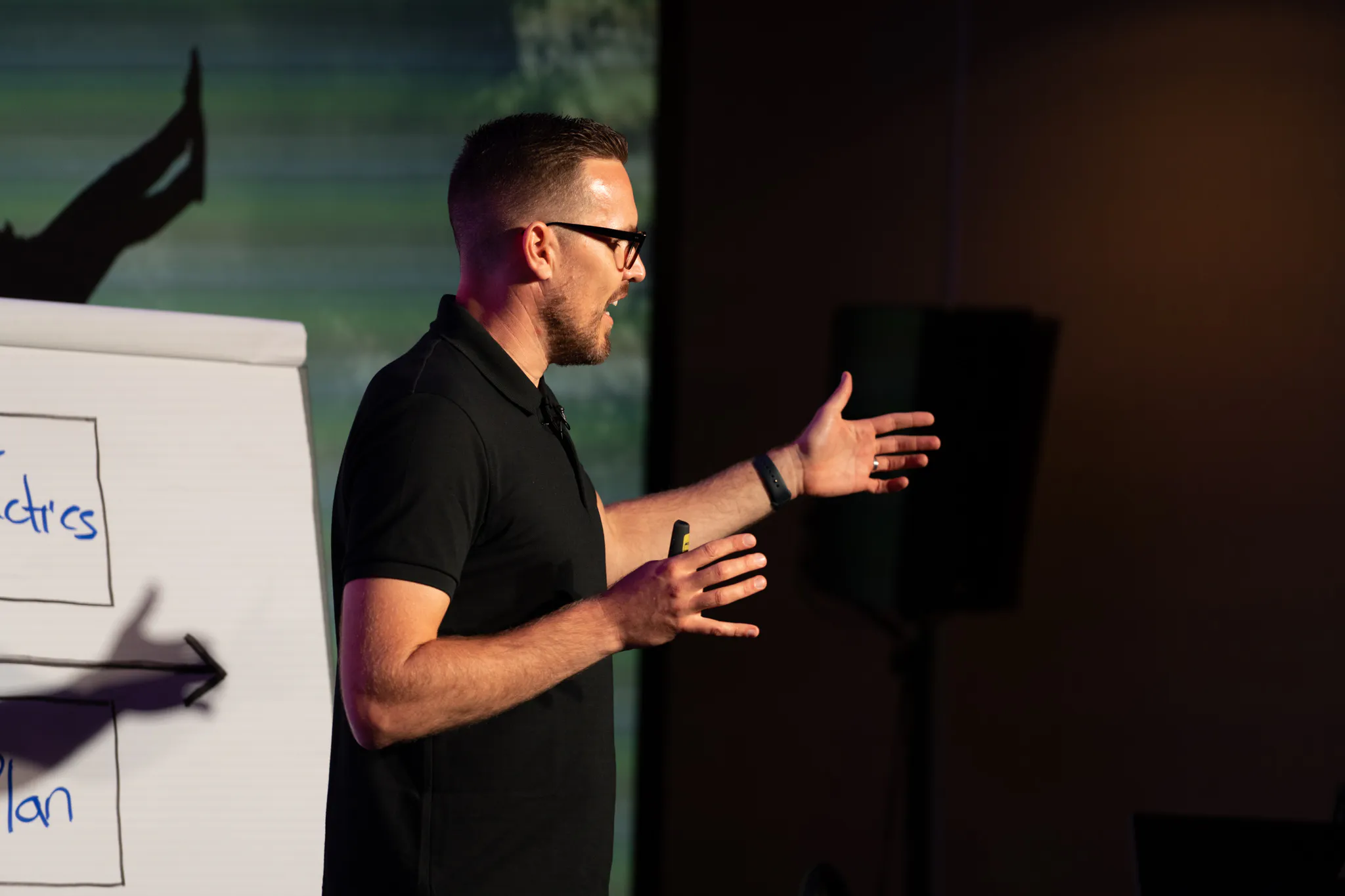 Coach Leighroy teaching a company framework on stage
