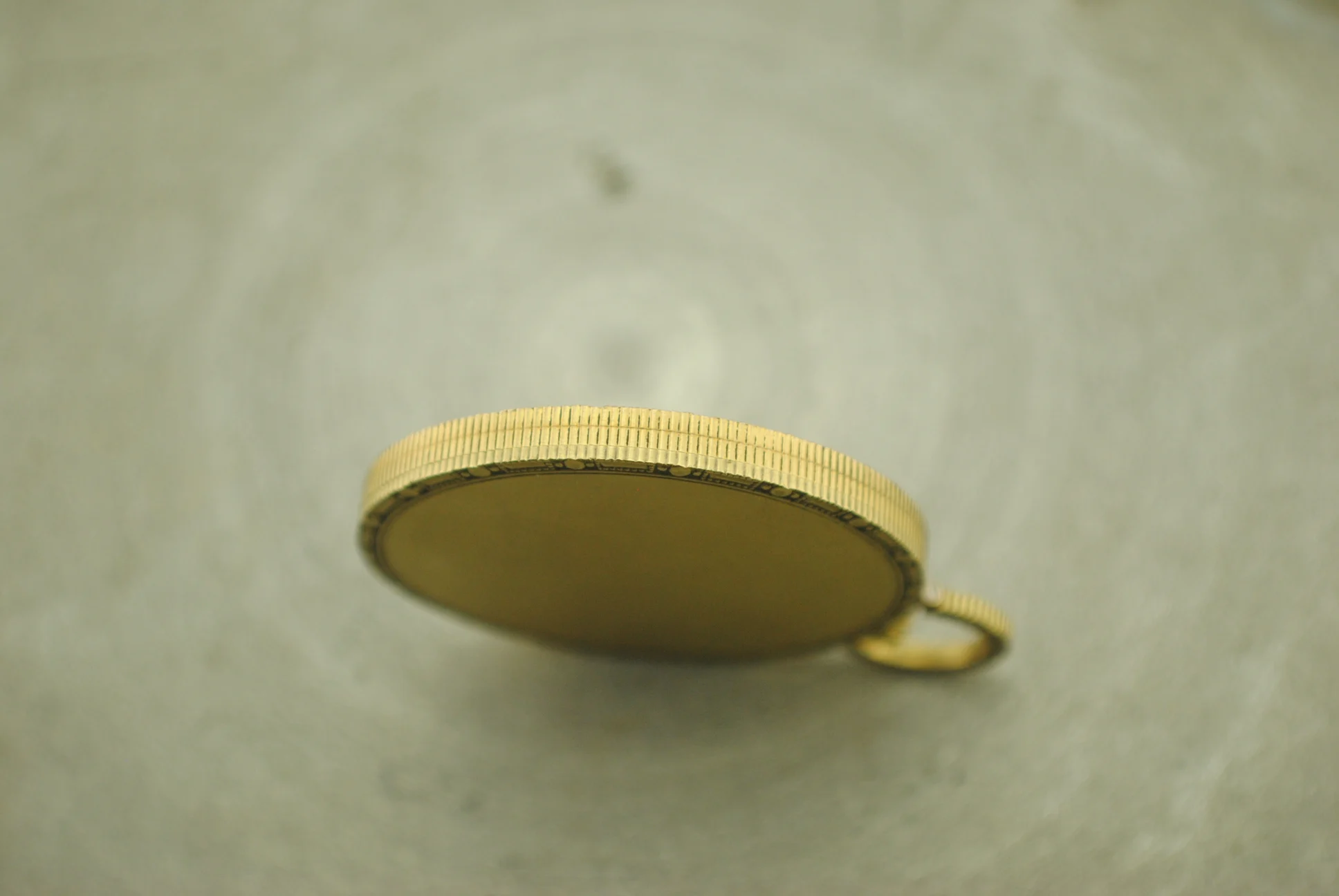 Side profile of the Audemars Piguet Jacquet pocket watch showing its coin edge and flat caseback