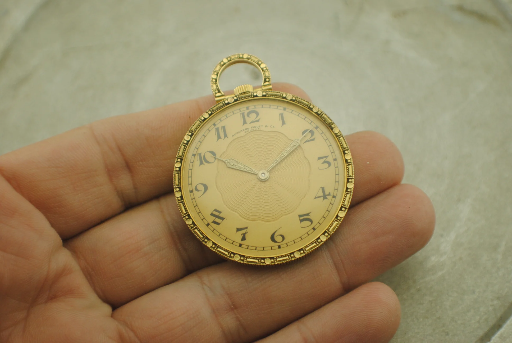 In-hand crystal-on view of the Audemars Piguet Jacquet showing its signed dial, decorative hands and suspension bow