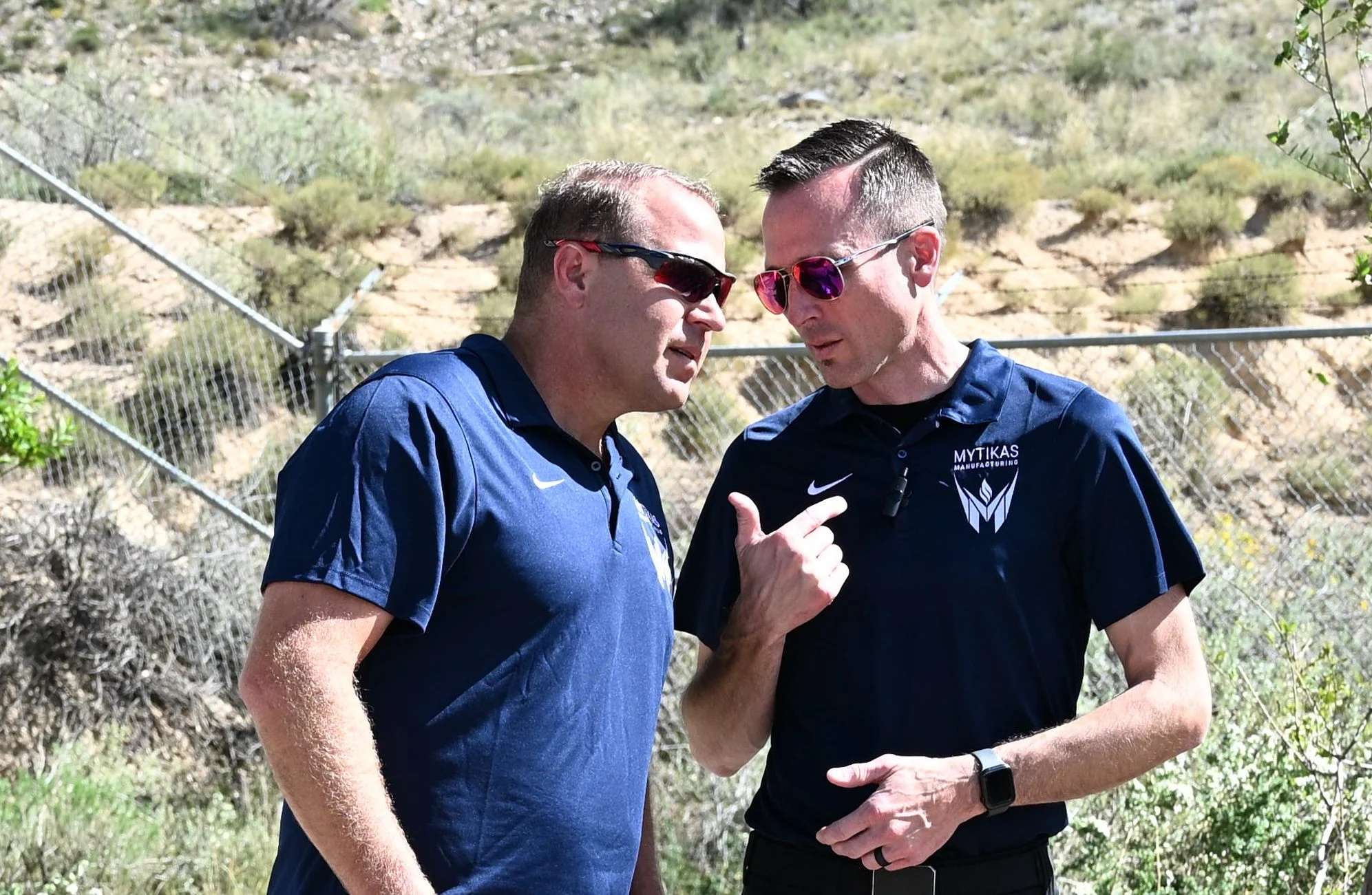 Two Mytikas founders talking outside the factory