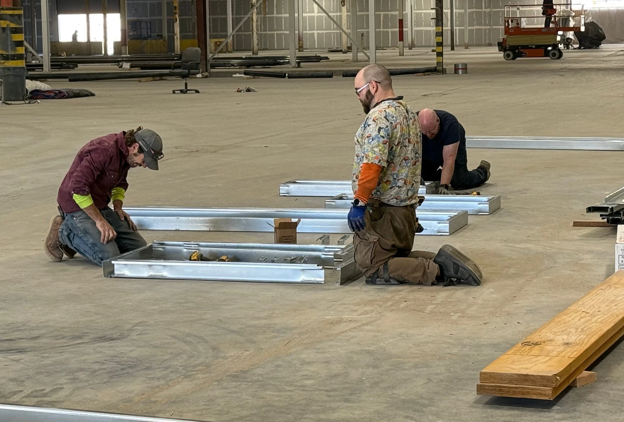 Mytikas crew assembling steel panels on the factory floor
