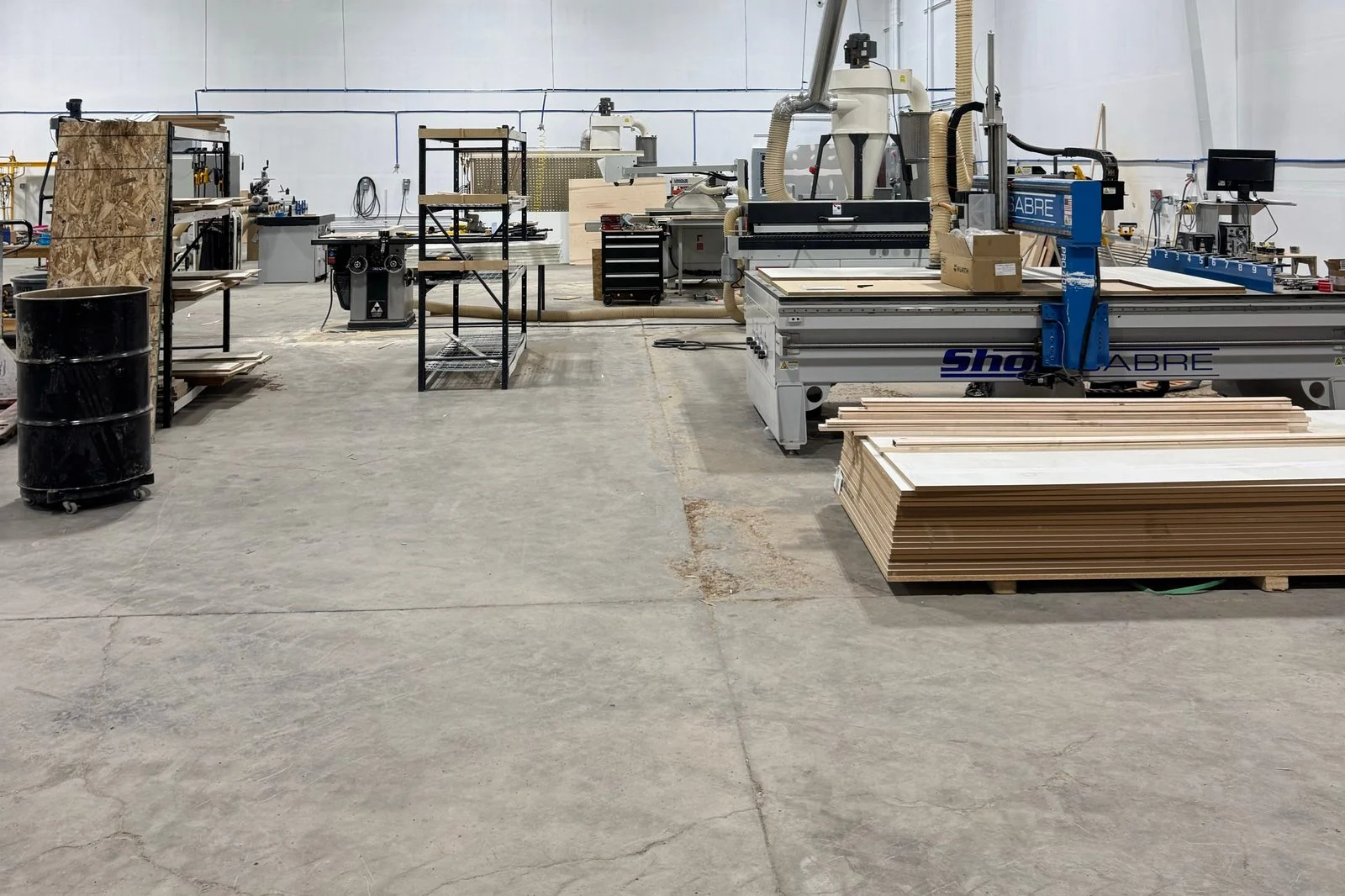 Woodworking equipment and cabinetry materials in the Mytikas shop