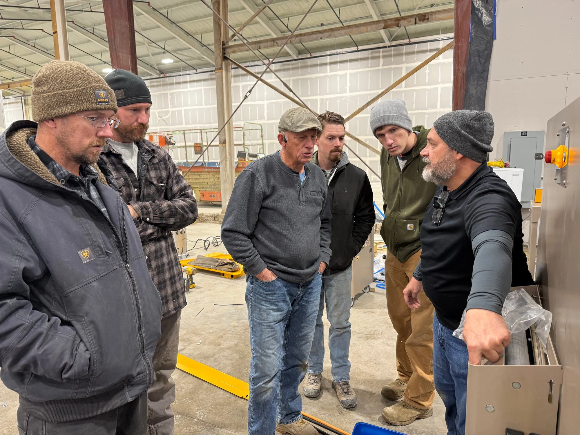 Mytikas crew gathered on the factory floor