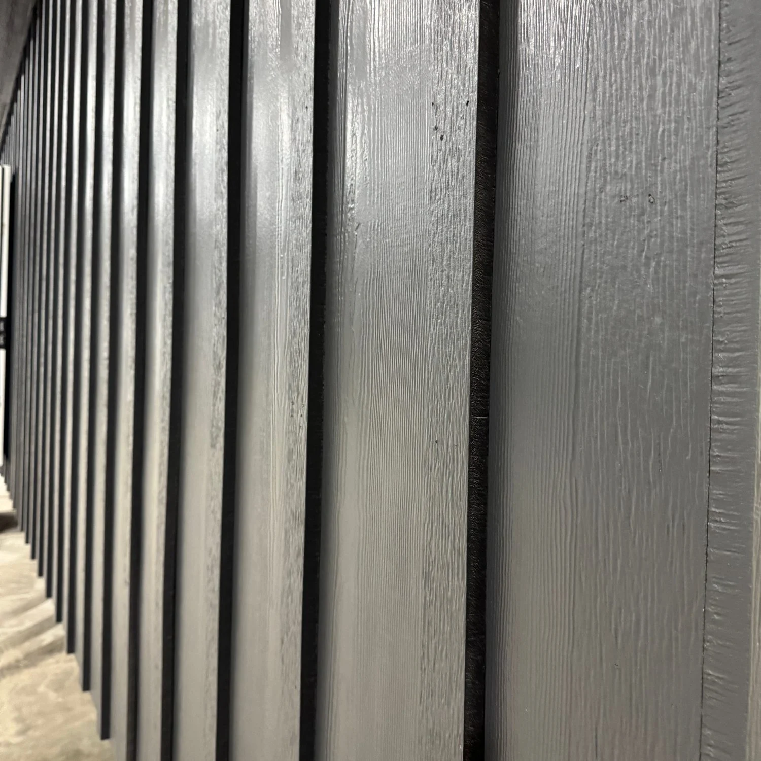 Dark siding with a wood-grain texture