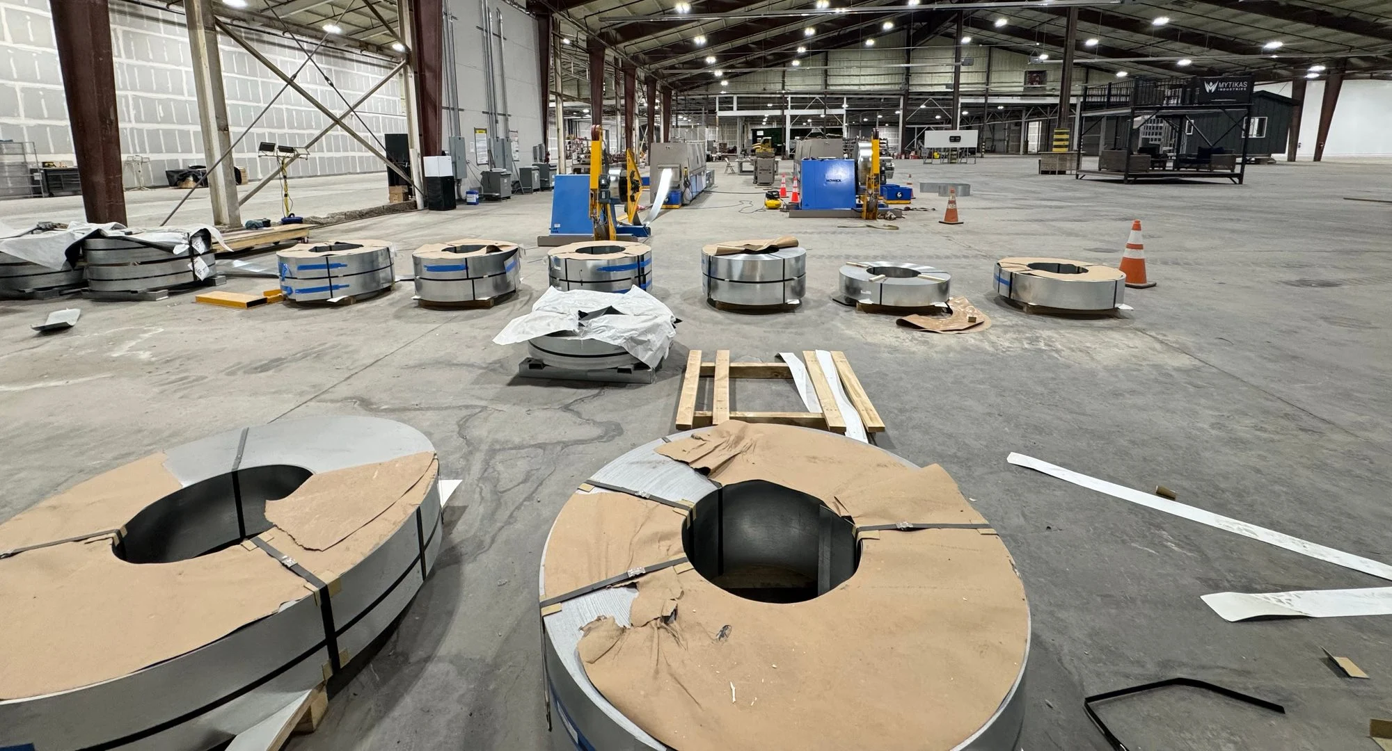 Steel coils arranged beside the roll-forming lines