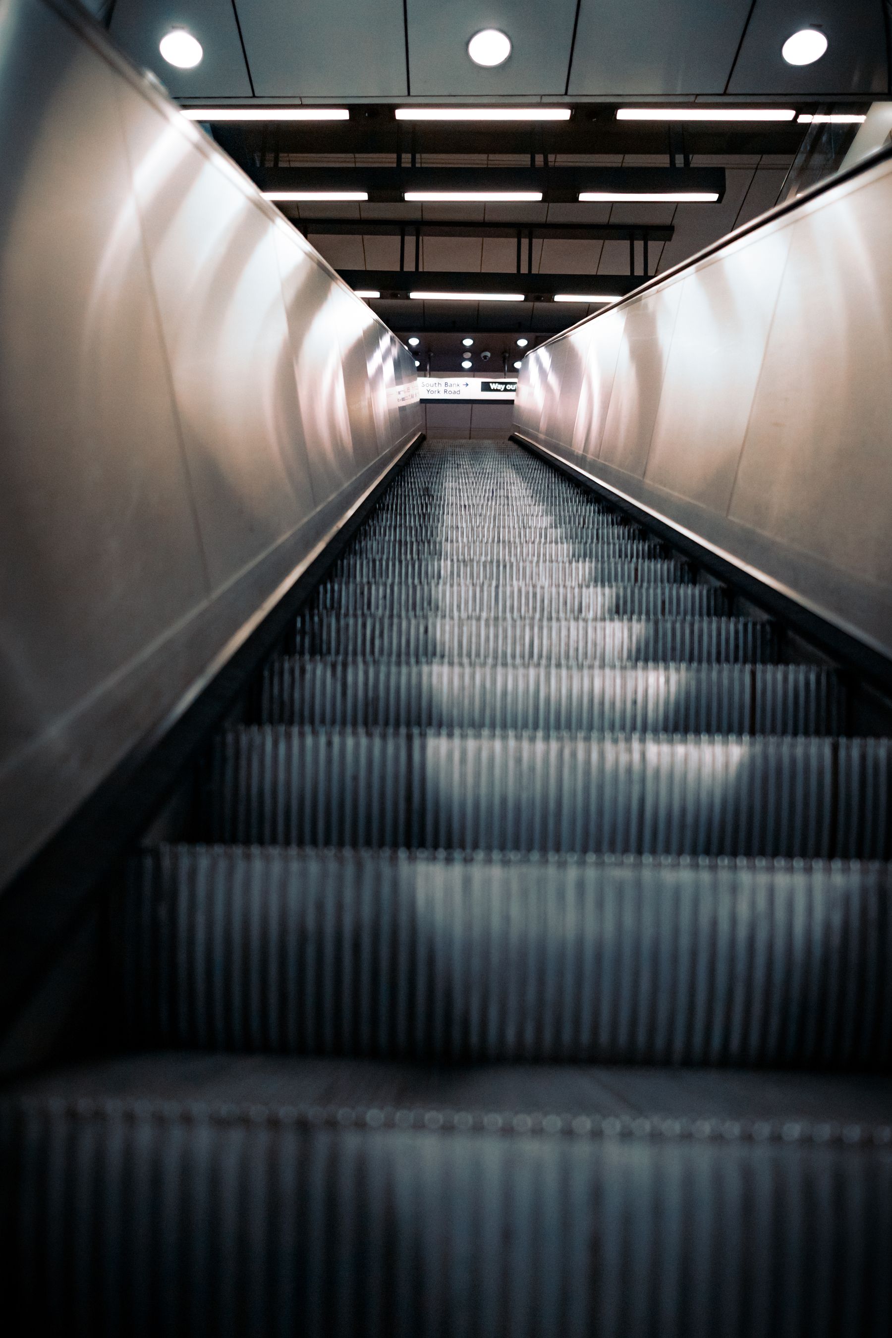 An abstract empty escalator with uninterrupted directional lines