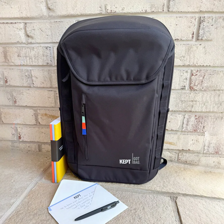 Company swag for new employees with GOT bag backpack, pen, notebook, and personalized insert.