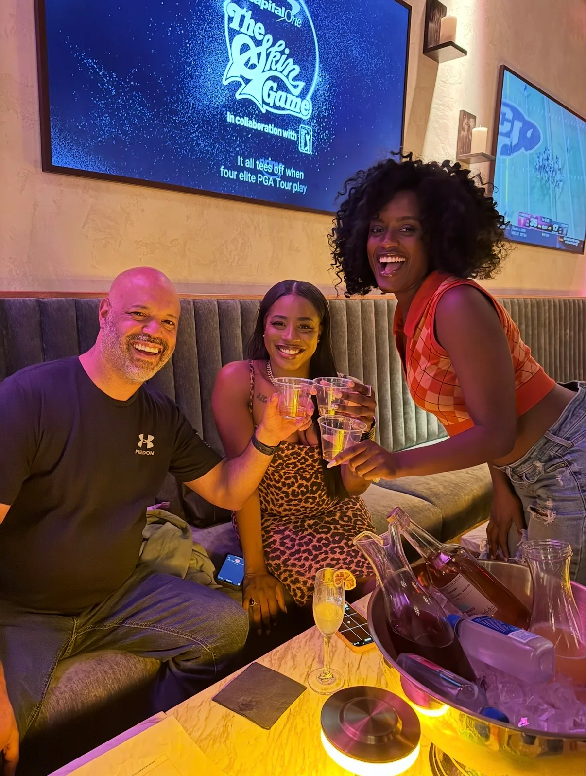Friends celebrating with drinks at a bar
