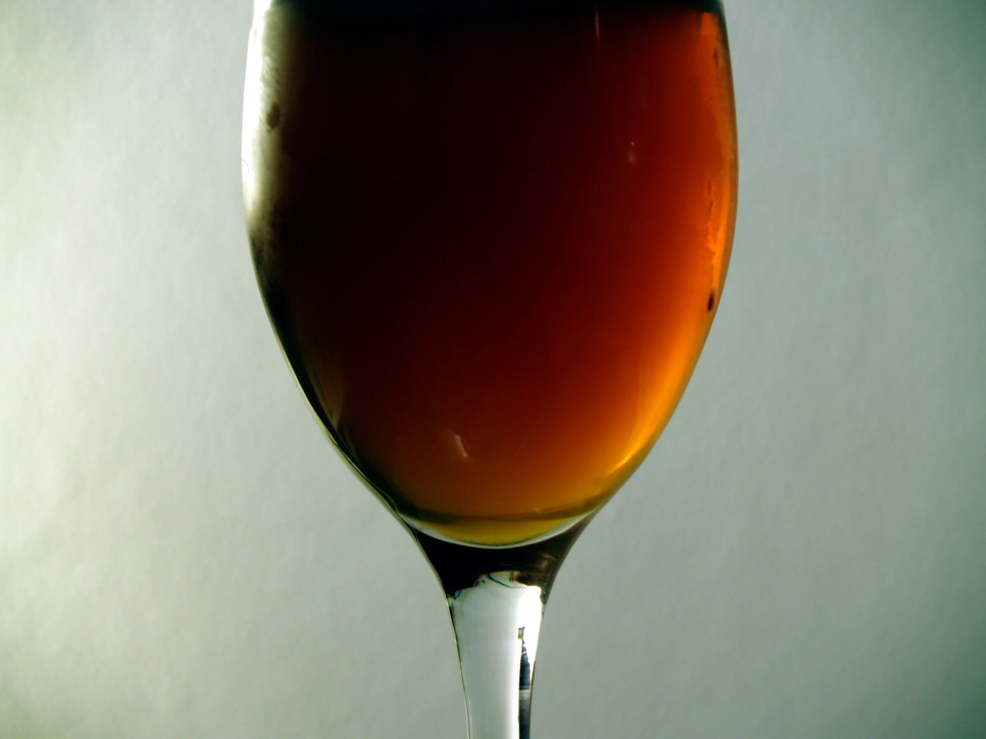Illustrative photograph: an unbranded pale ale in a stemmed glass