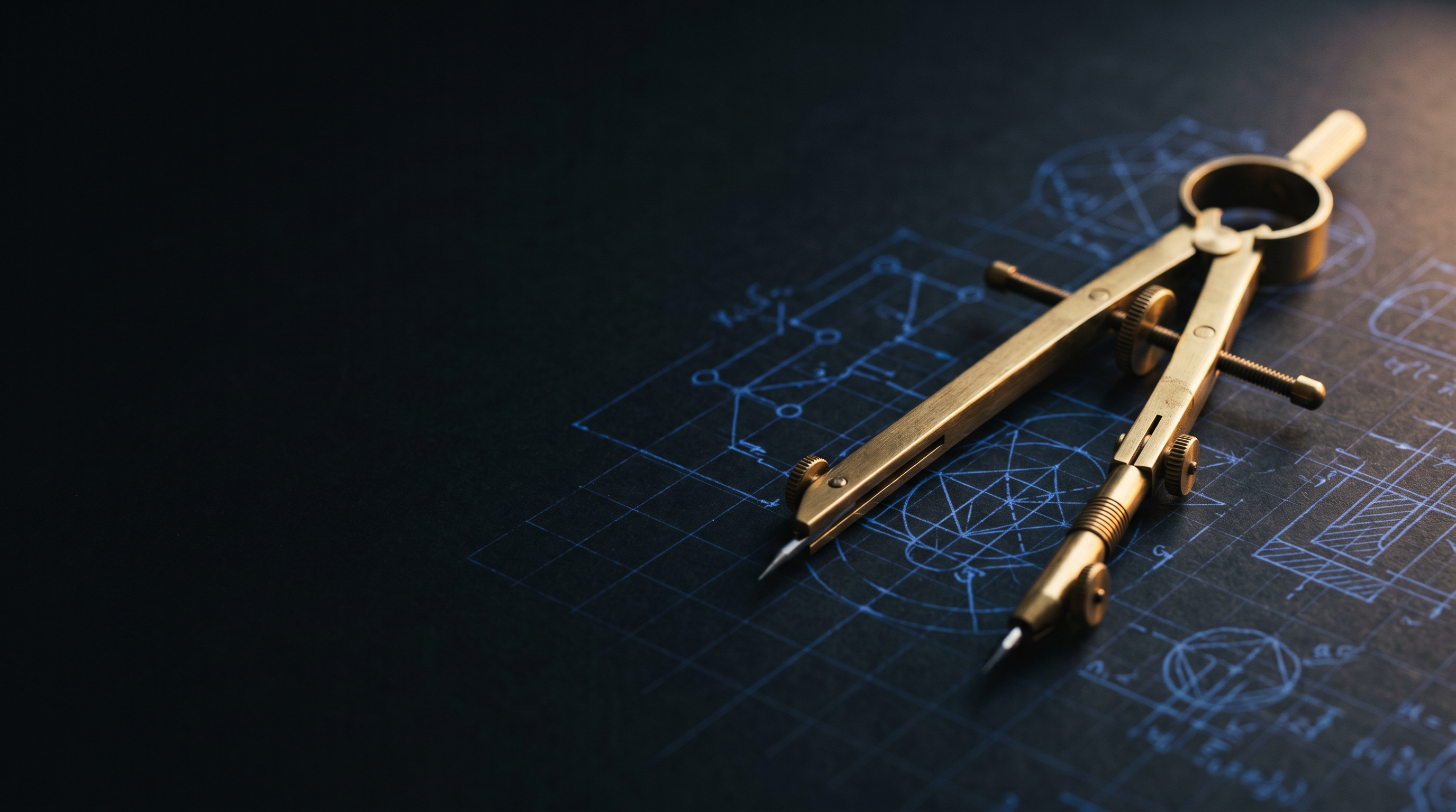 Brass drafting dividers resting on a dark blueprint with faint cobalt schematic linework
