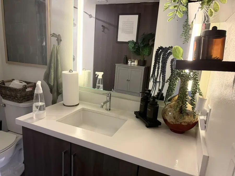 Bathroom vanity and mirror before cleaning