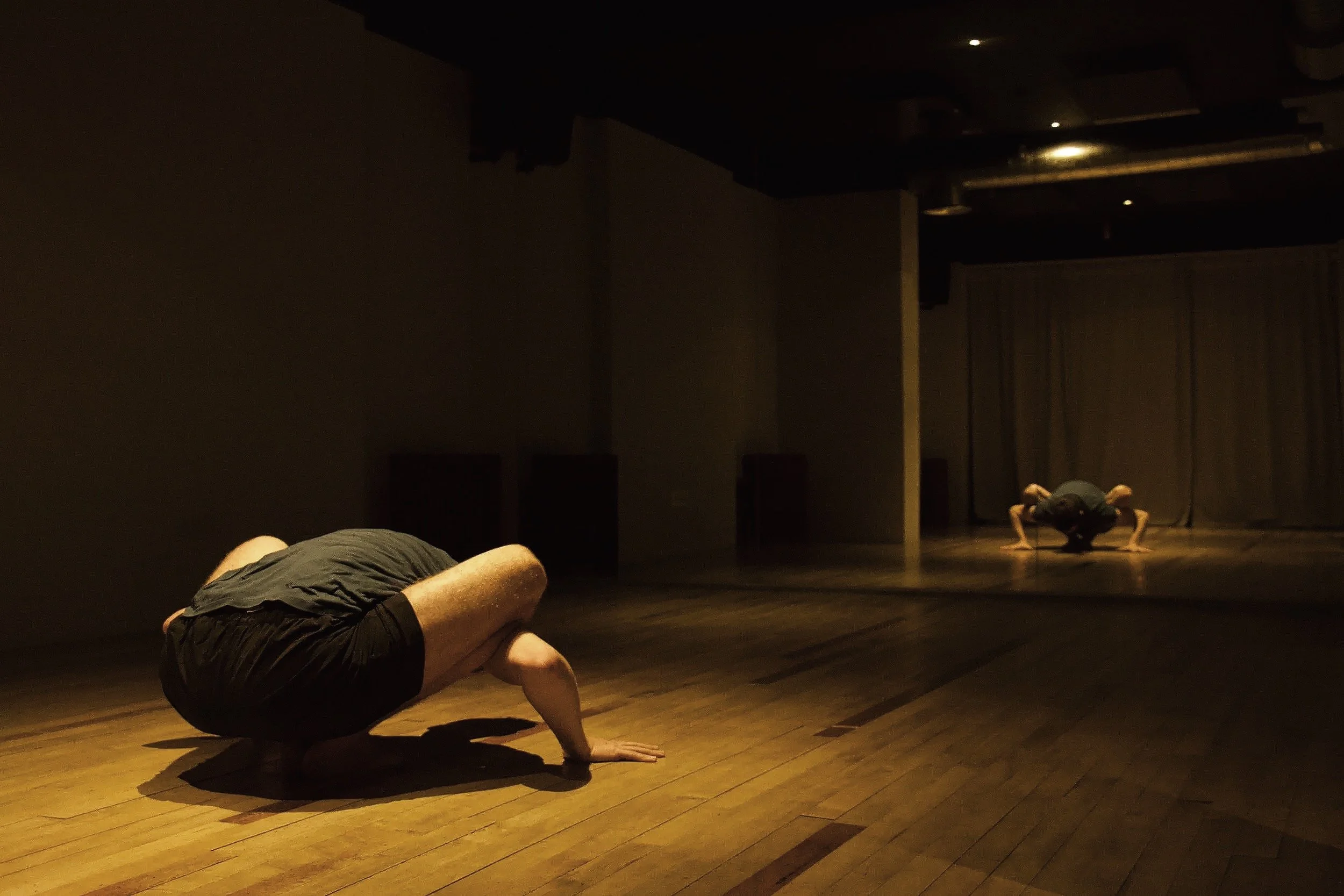 A student practising on the wooden floor of the RebelStudio yoga room