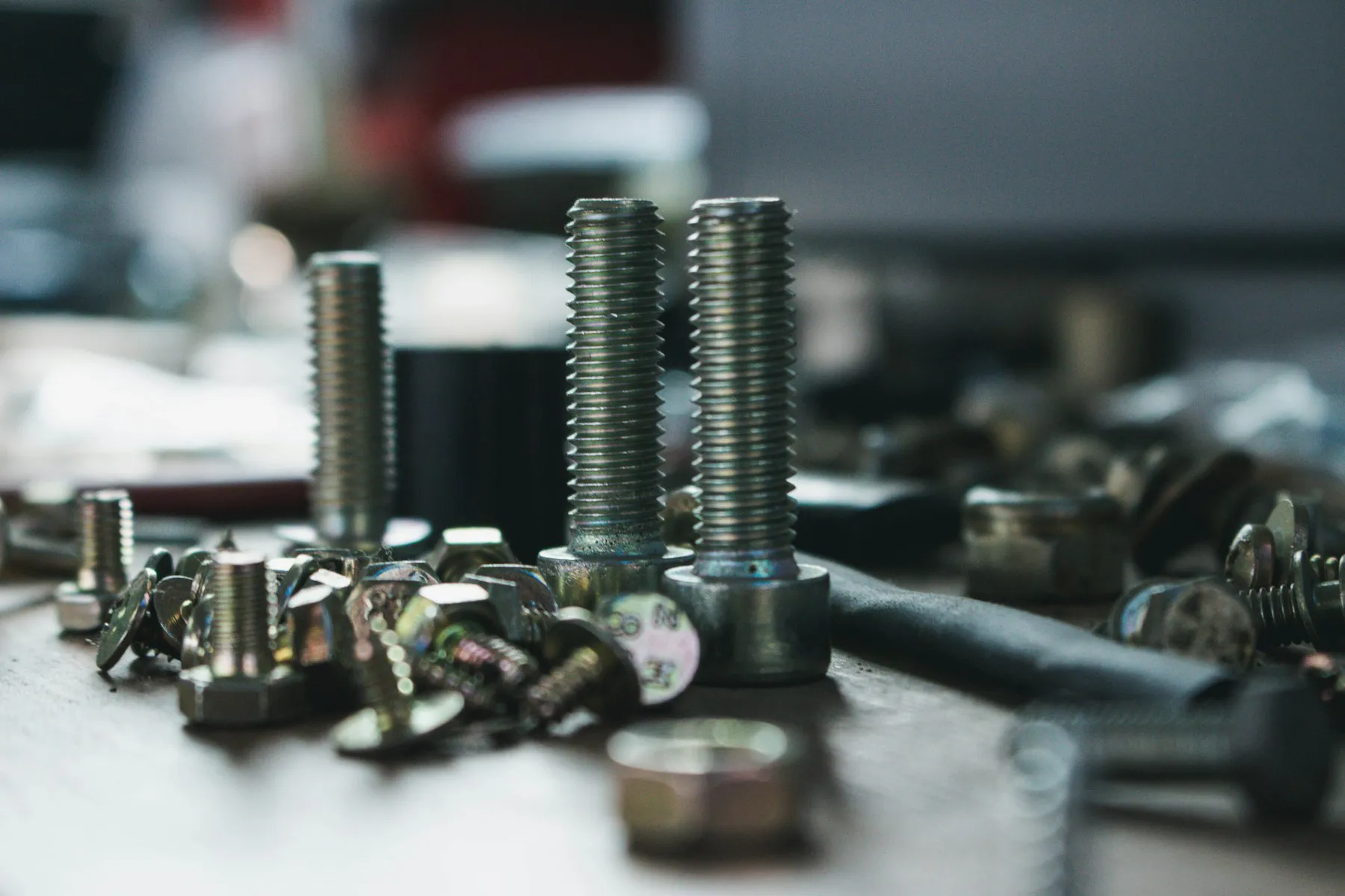 Assorted industrial fasteners on a workbench