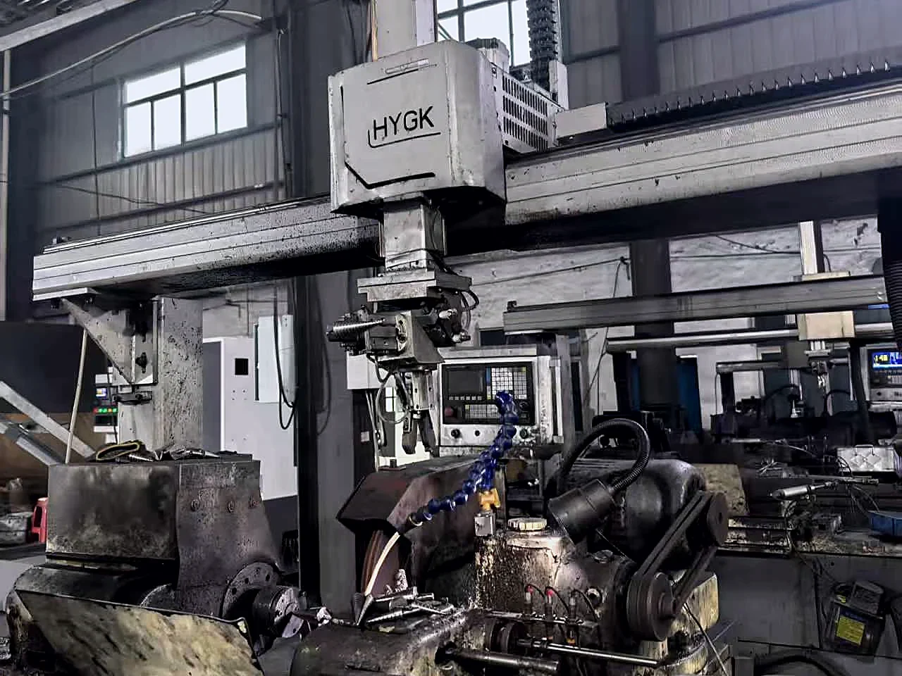 Gantry machine and grinding stations on the drill bit workshop floor