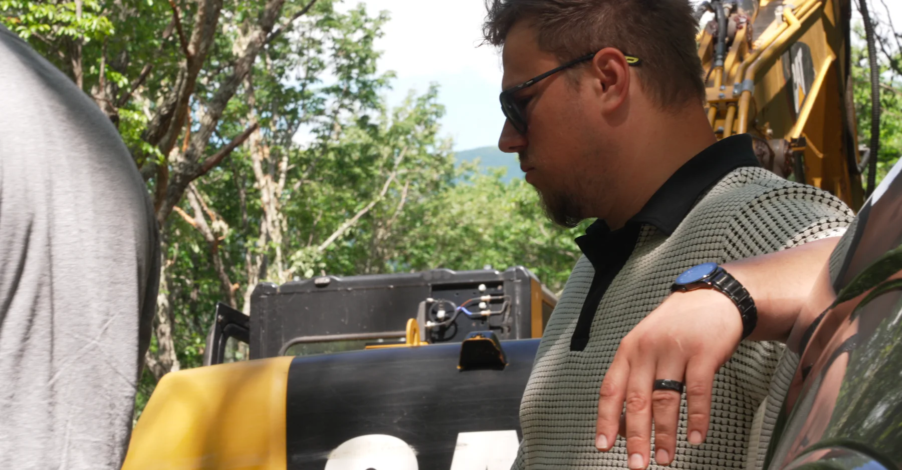 HTL Builders founder Surge Kalashnik reviewing project plans on a jobsite