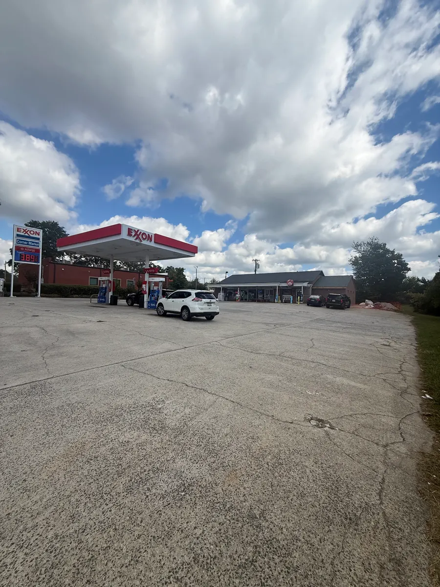 Existing gas station and forecourt, shown as context for the addition