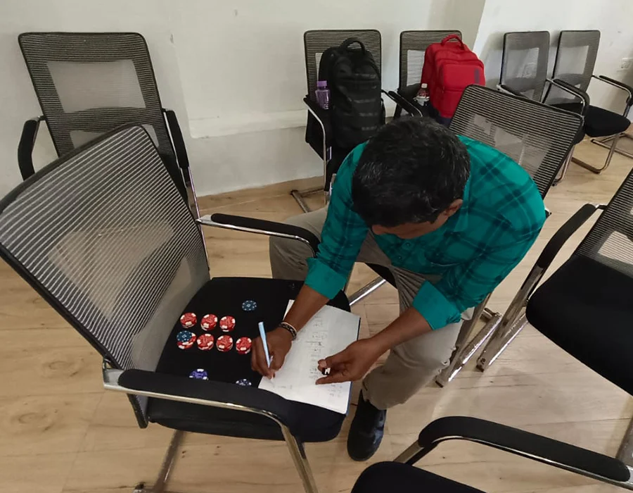 A participant records decisions during a BlueSky Learning leadership exercise