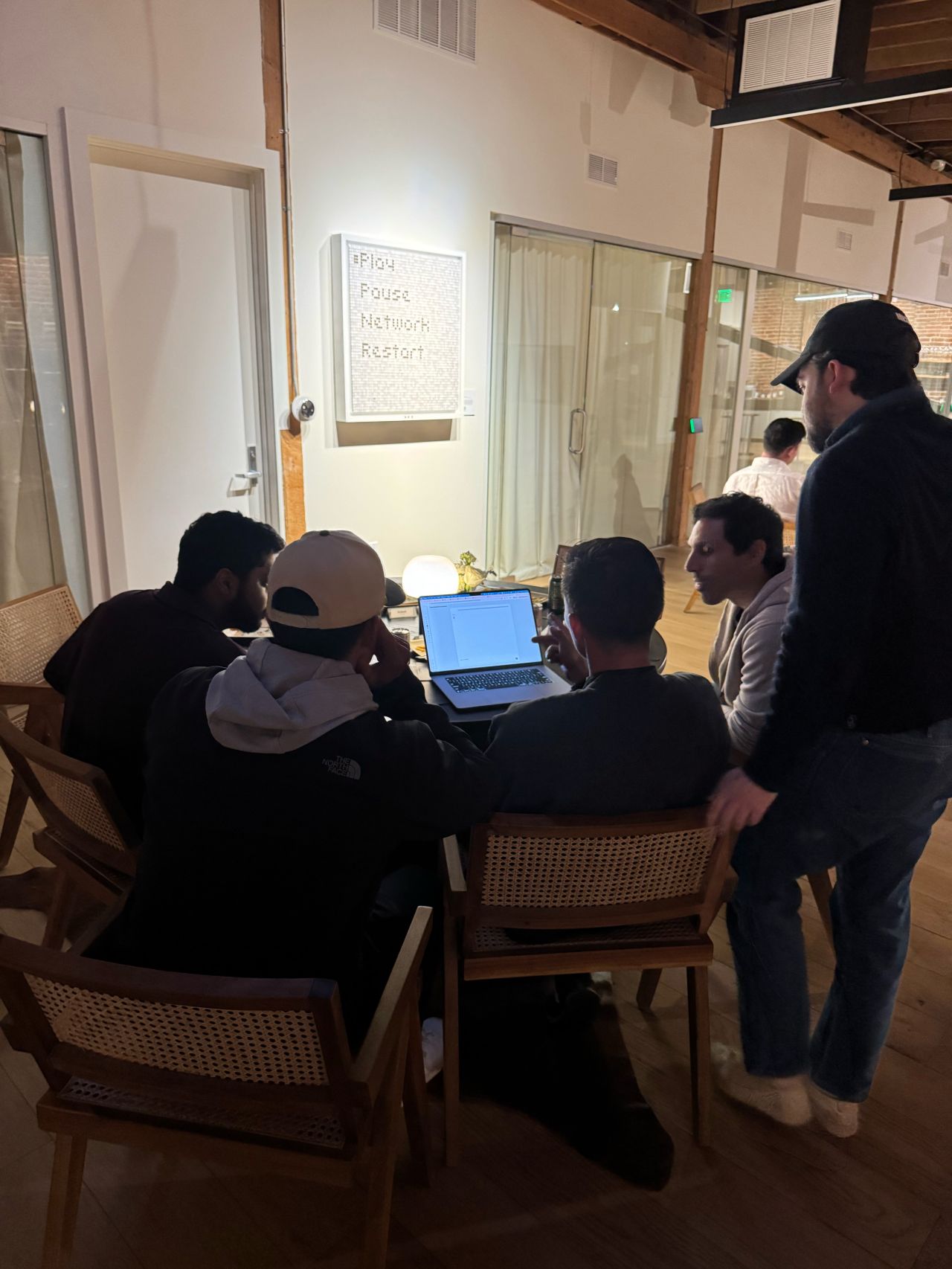 The Ploy team collaborating around a table
