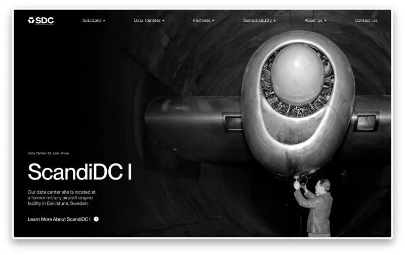 Scandinavian Data Centers ScandiDC I website with a black-and-white photograph of a technician working on an aircraft engine