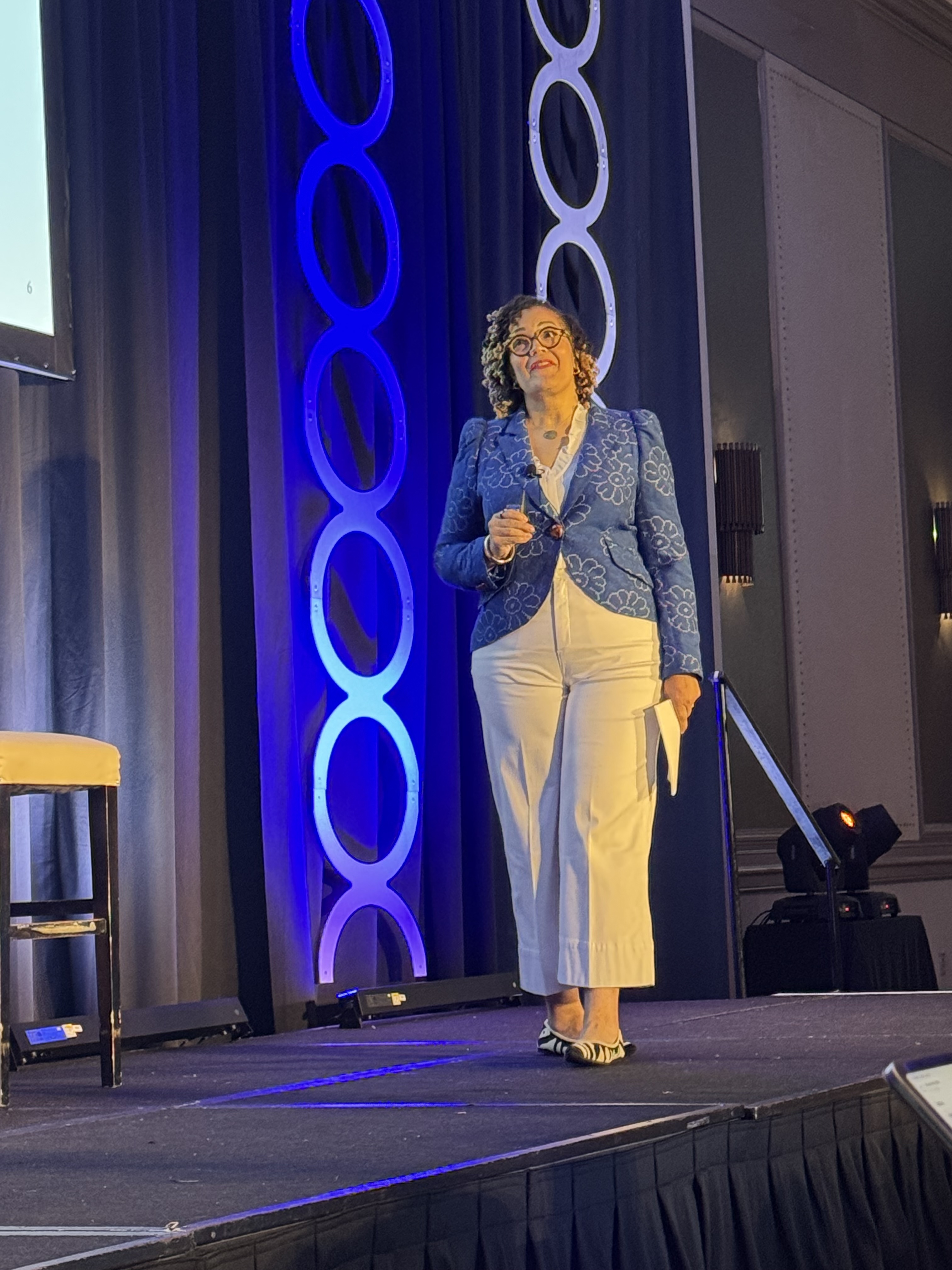 Tash Durkins speaking on stage at the FTA conference